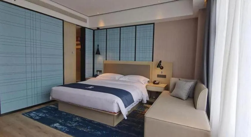 Bed in Echarm Hotel Changjiang Shilu