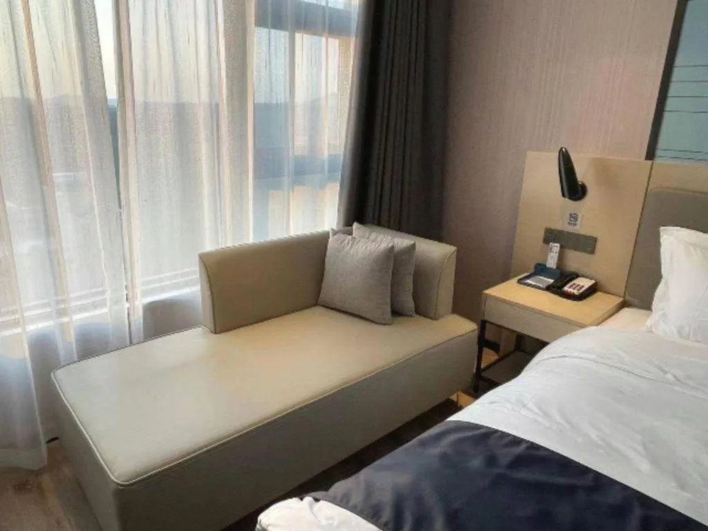Bed in Echarm Hotel Changjiang Shilu