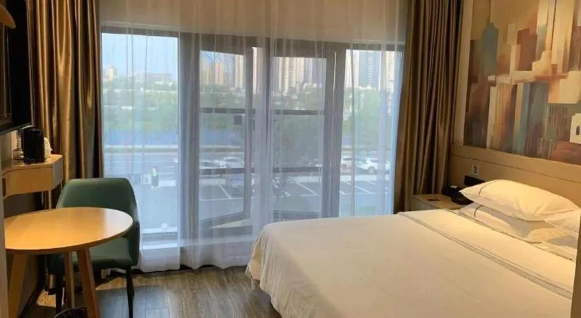 Bed in City Comfort Inn Wuhan Yangluo Wanda Plaza