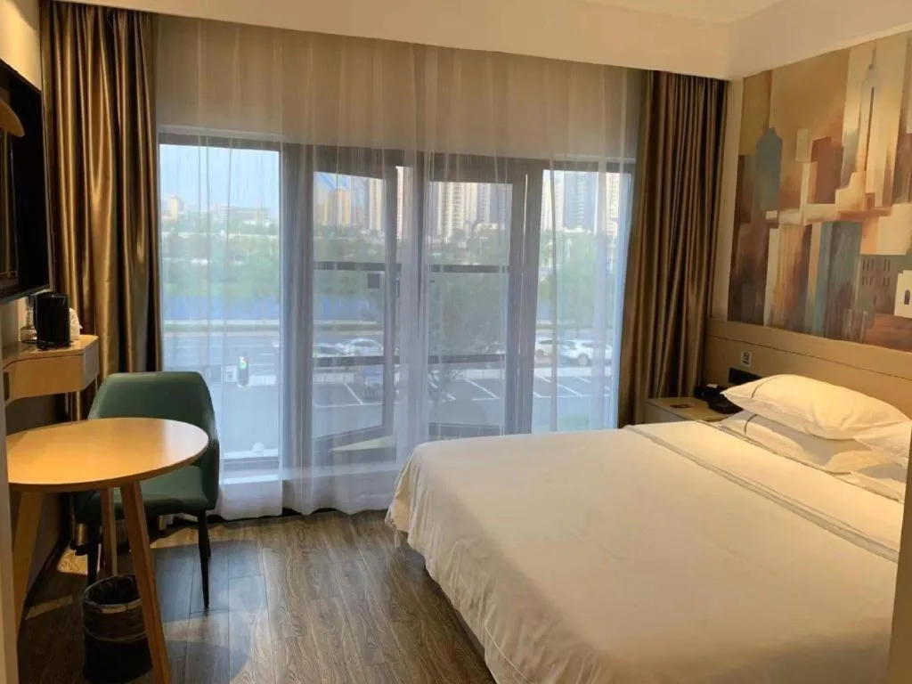 Bed in City Comfort Inn Wuhan Yangluo Wanda Plaza