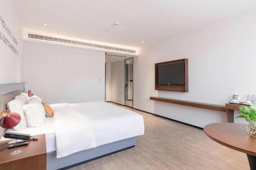 Bed in City Comfort Premier Hotel Nanning Guangxi University Zoo Metro Station