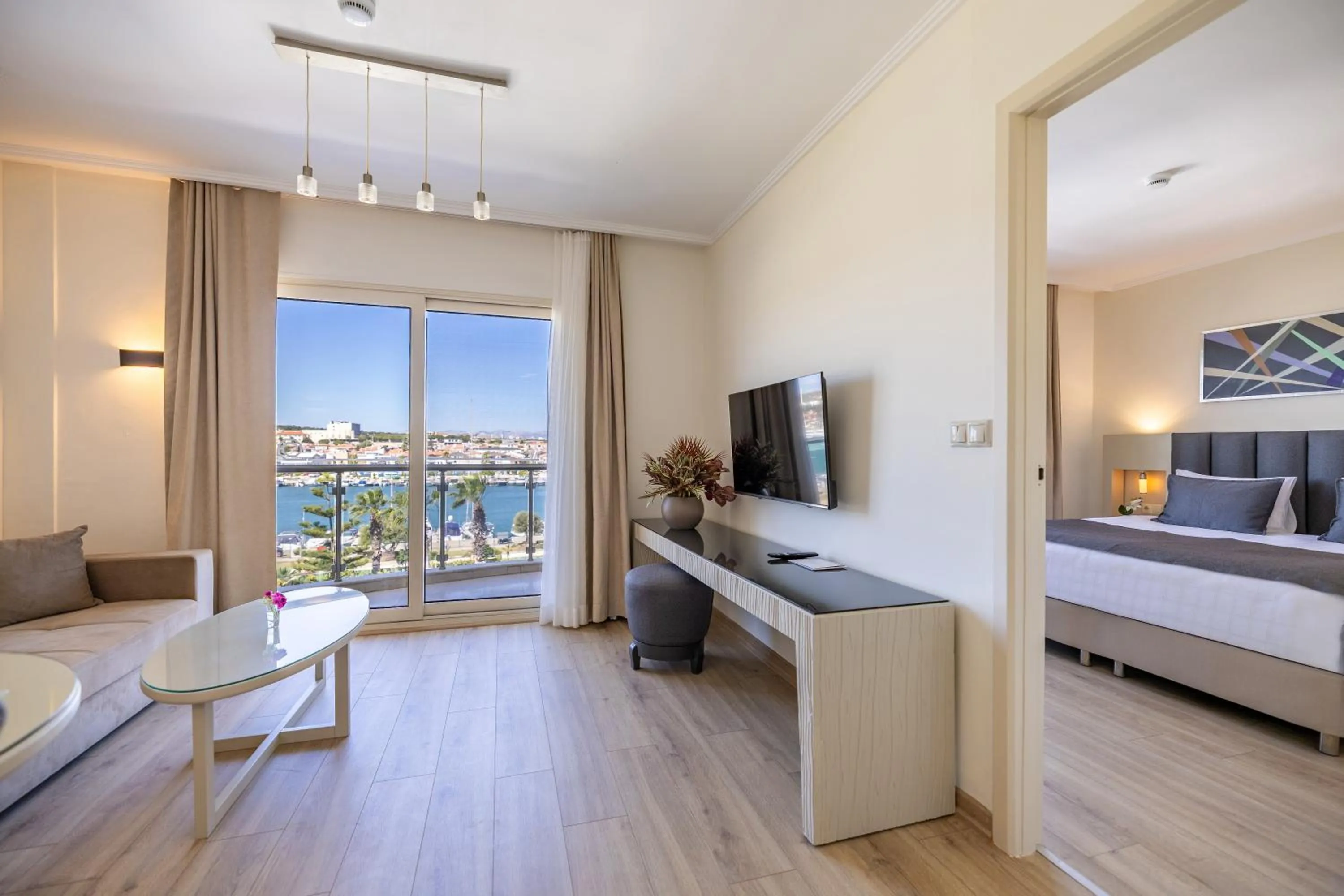 Communal lounge/ TV room, Bed in Sisus Marina Hotel