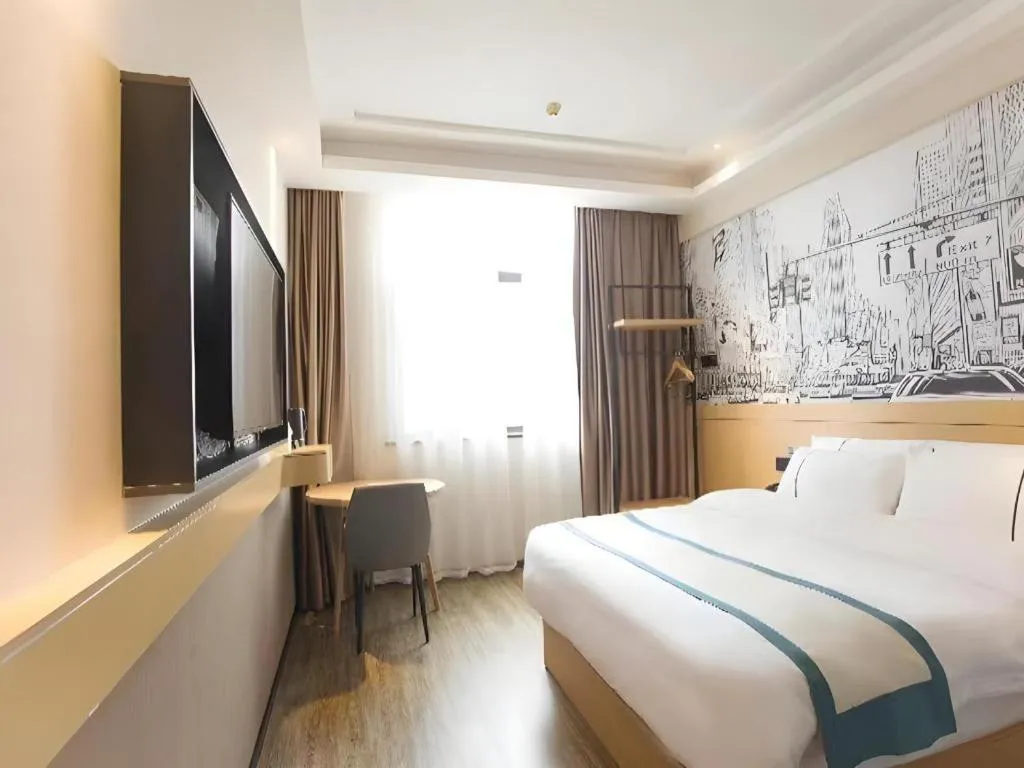 Bed in City Comfort Inn Jiujiang Gongqing Science and Technology College High-speed Railway Station