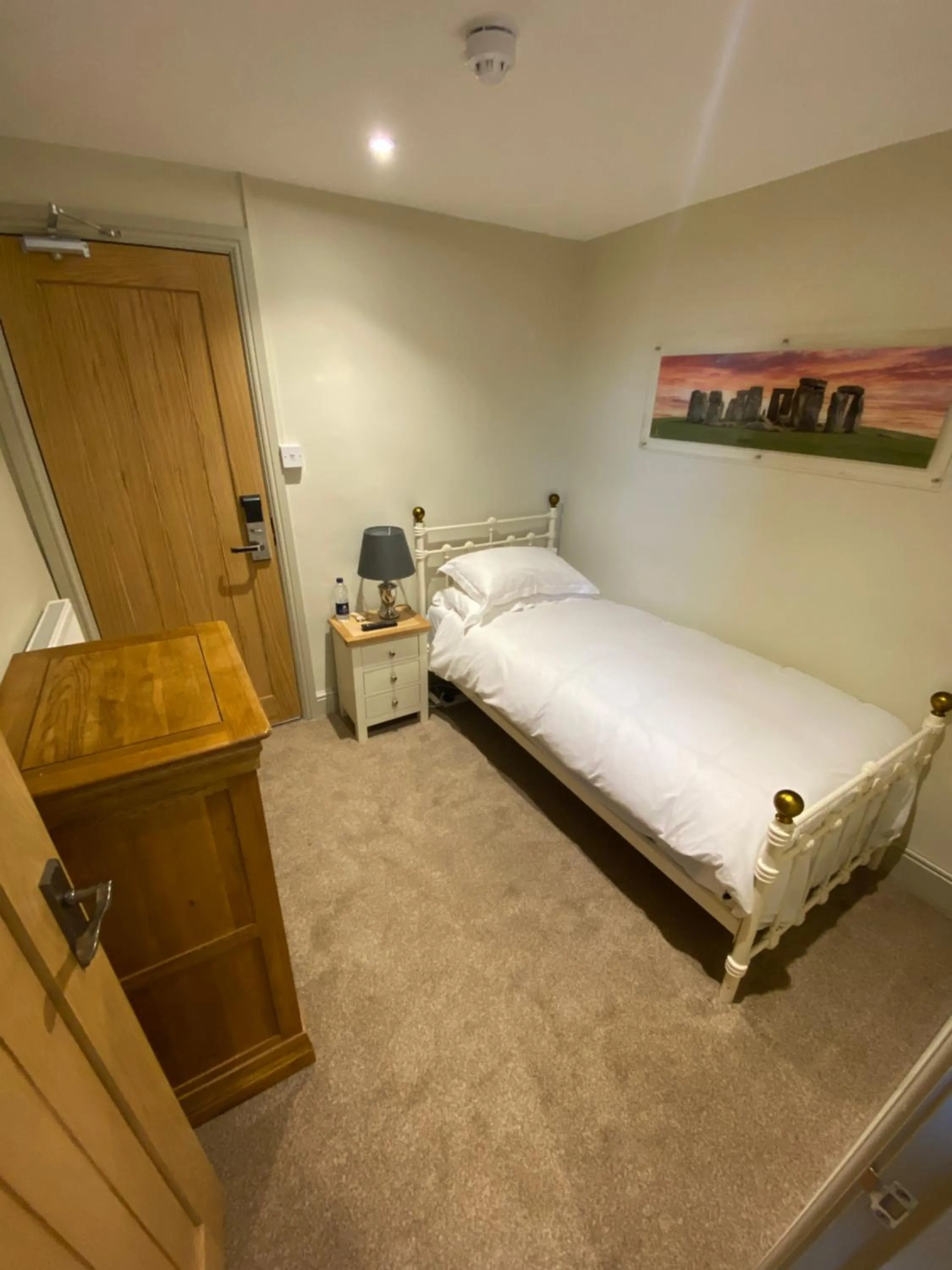 Bed in The Peppermill Town house Hotel & Restaurant