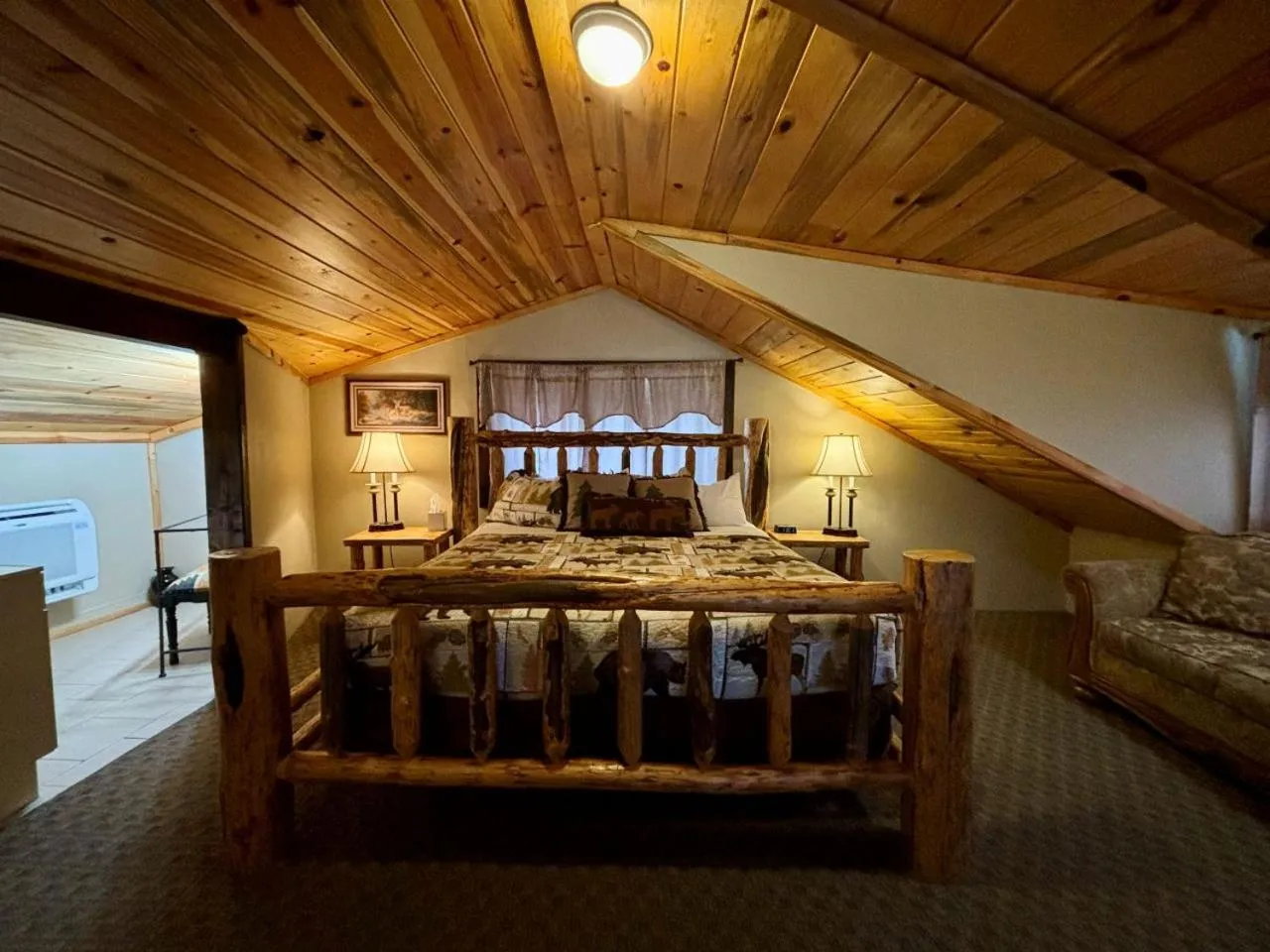 Bed in Riverfront Motel & Cabins