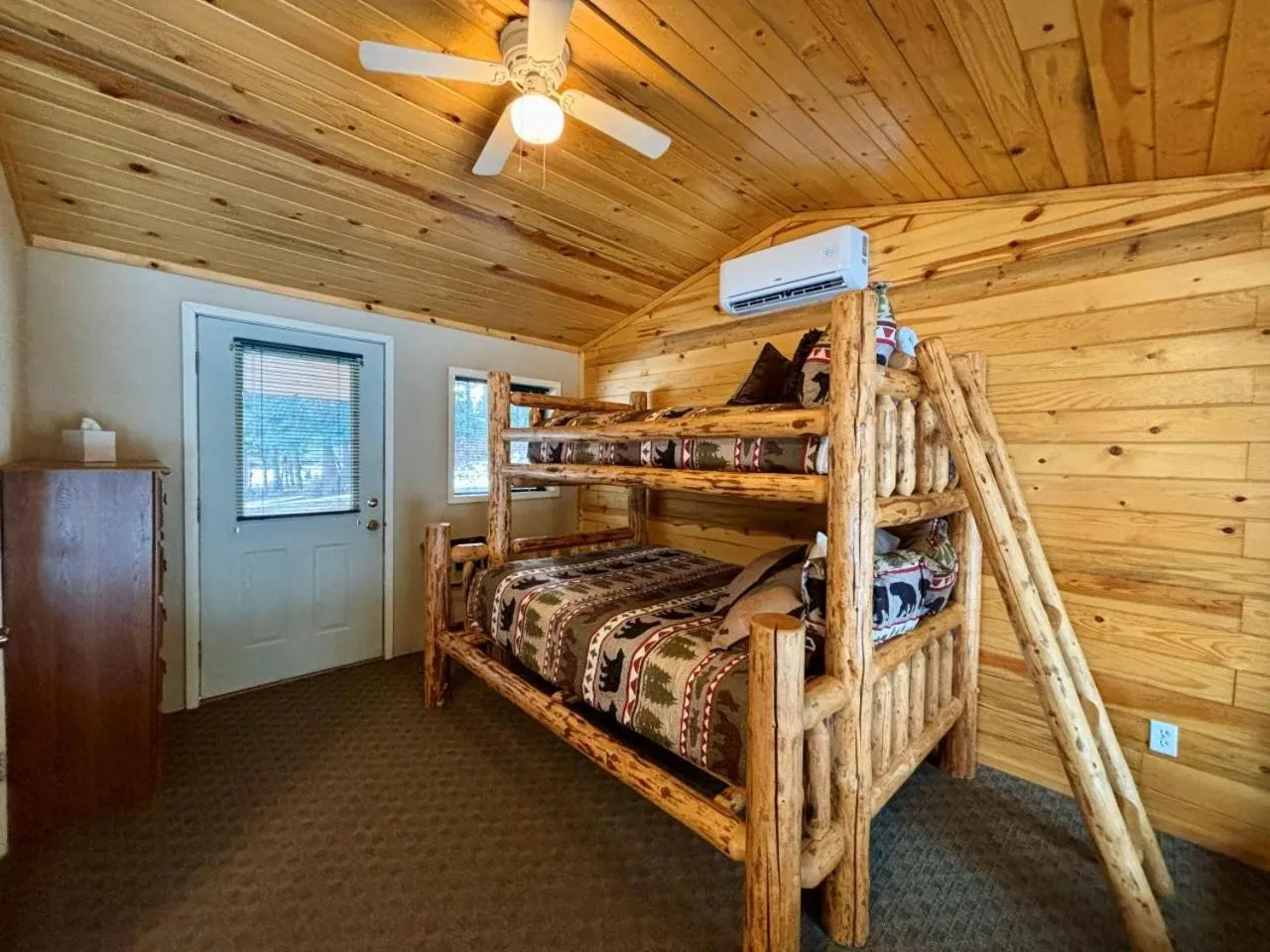 Bed in Riverfront Motel & Cabins