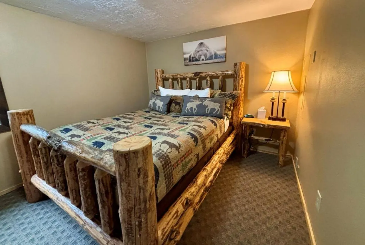 Bed in Riverfront Motel & Cabins