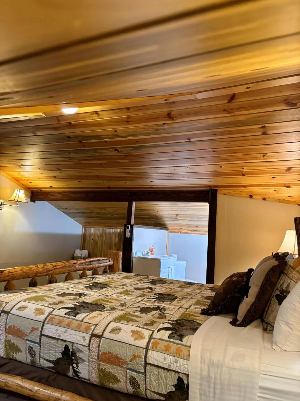 Bed in Riverfront Motel & Cabins