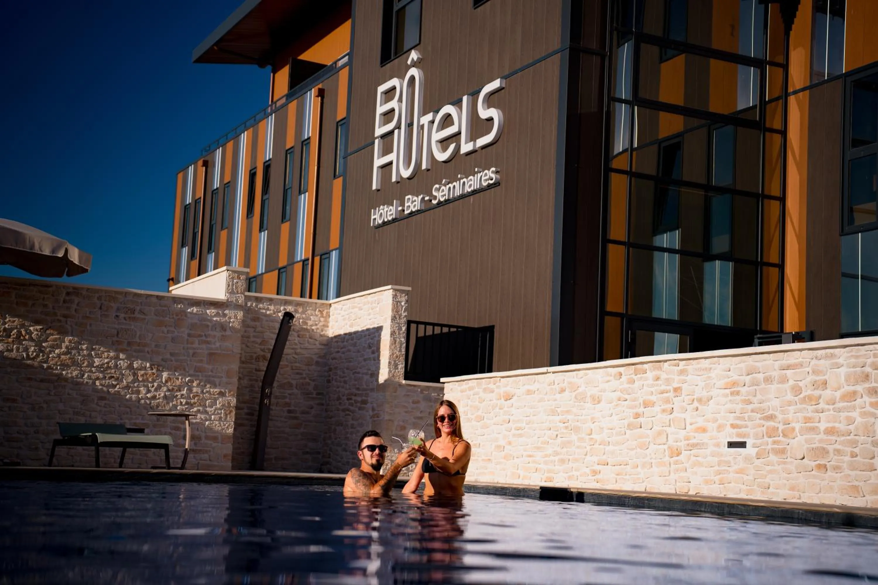 Swimming pool in Bô Hôtels Ambronay