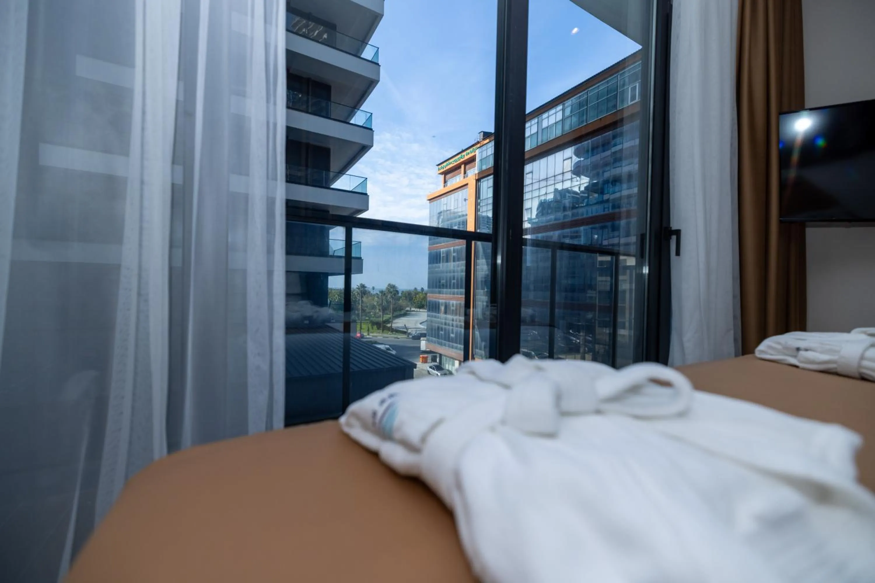 Property building, Bed in New Wave Apart-Hotel