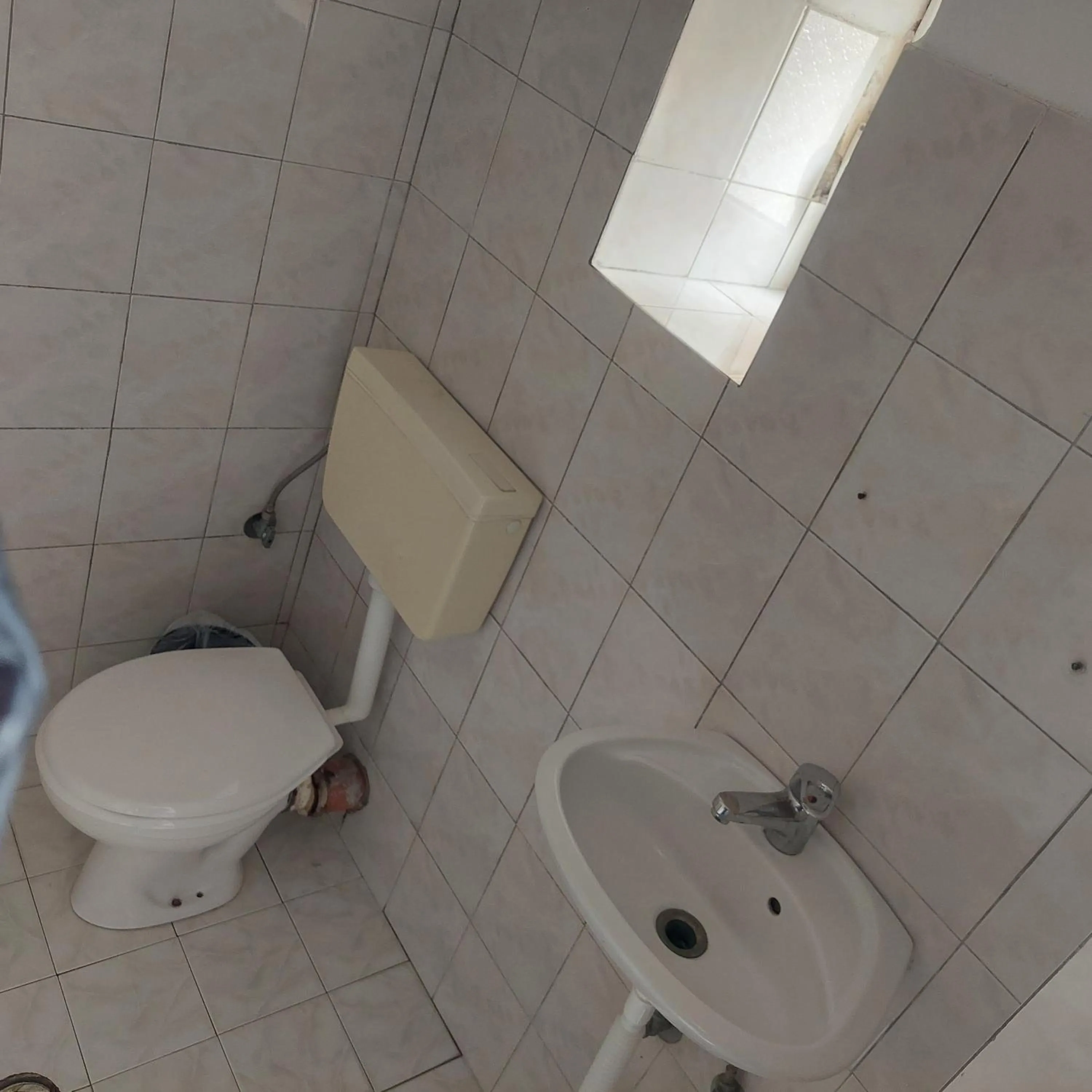 Toilet in Casa Mia Economy Condos