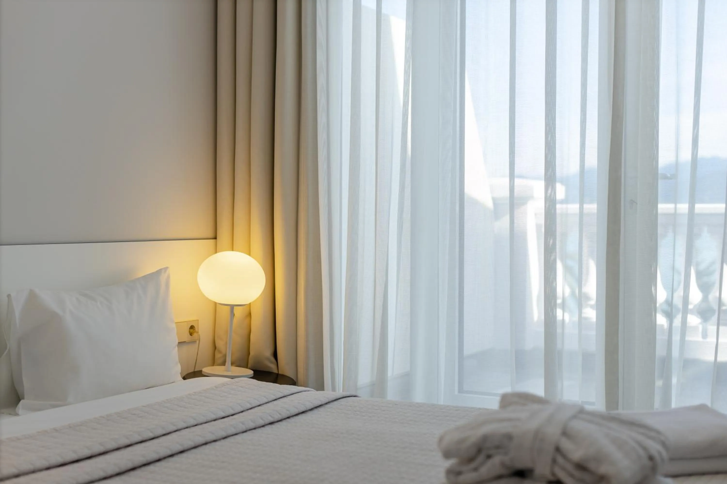 Bed in Le Port Boutique Apart Hotel