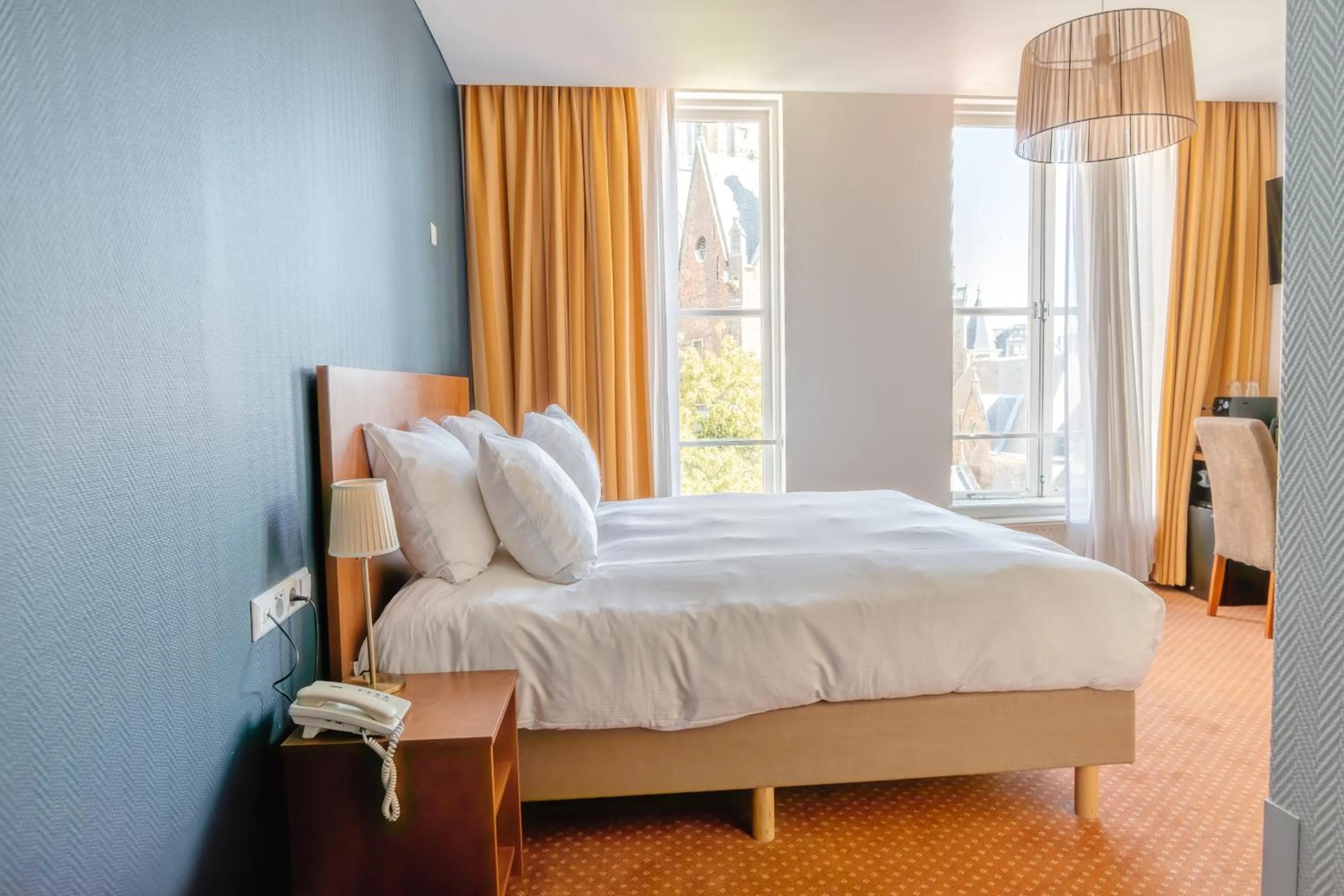 Bed in Ambassador City Centre Hotel