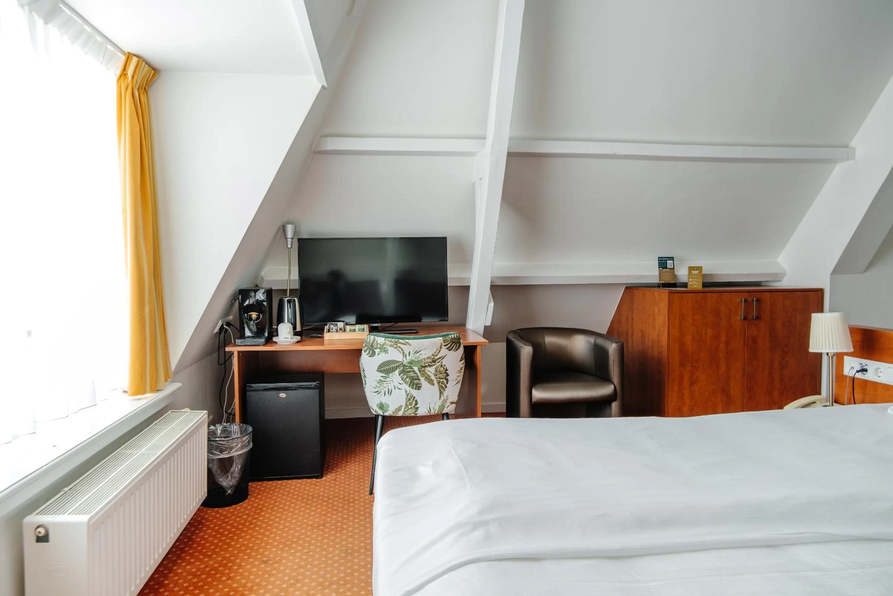 Bed in Ambassador City Centre Hotel