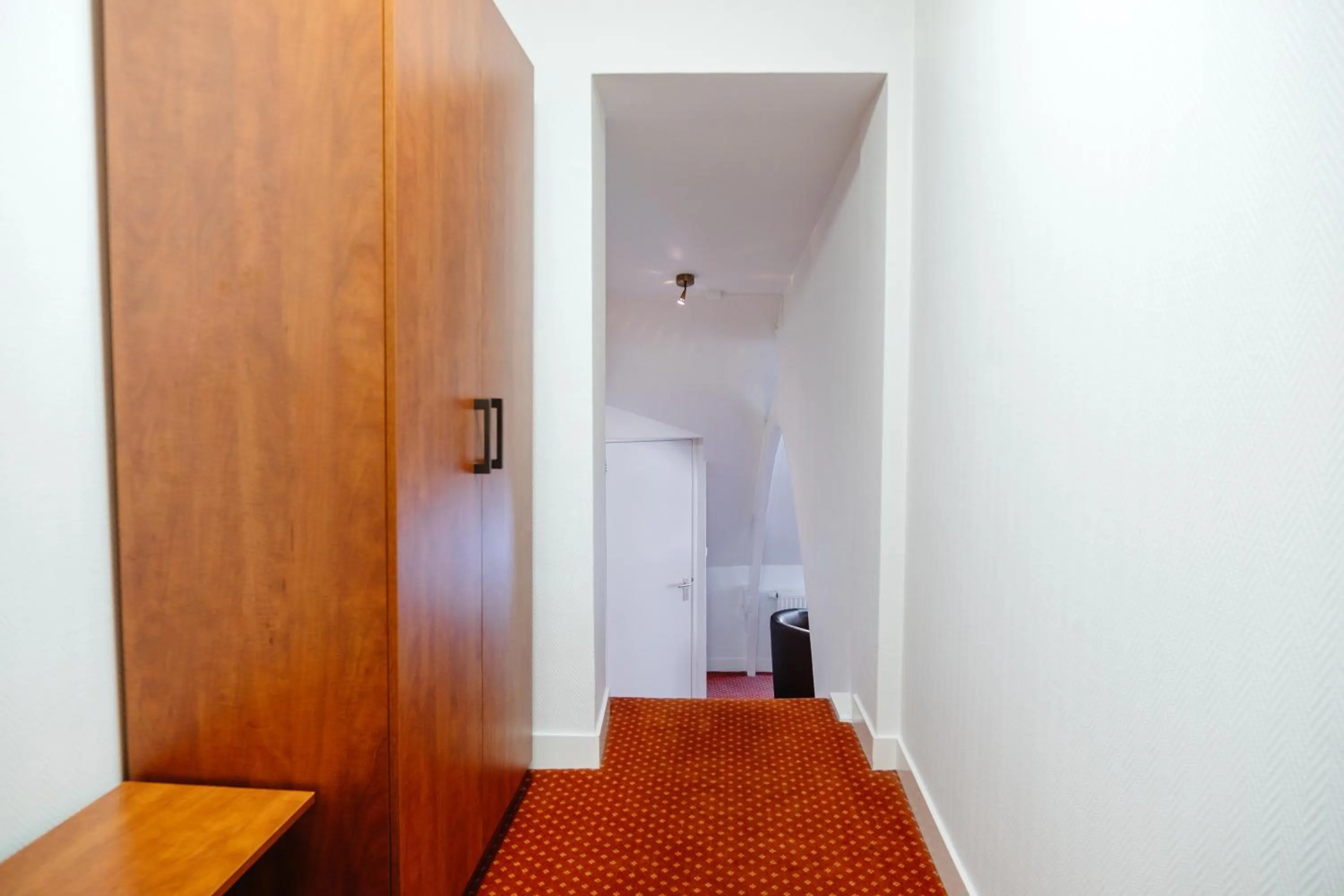 Bedroom in Ambassador City Centre Hotel