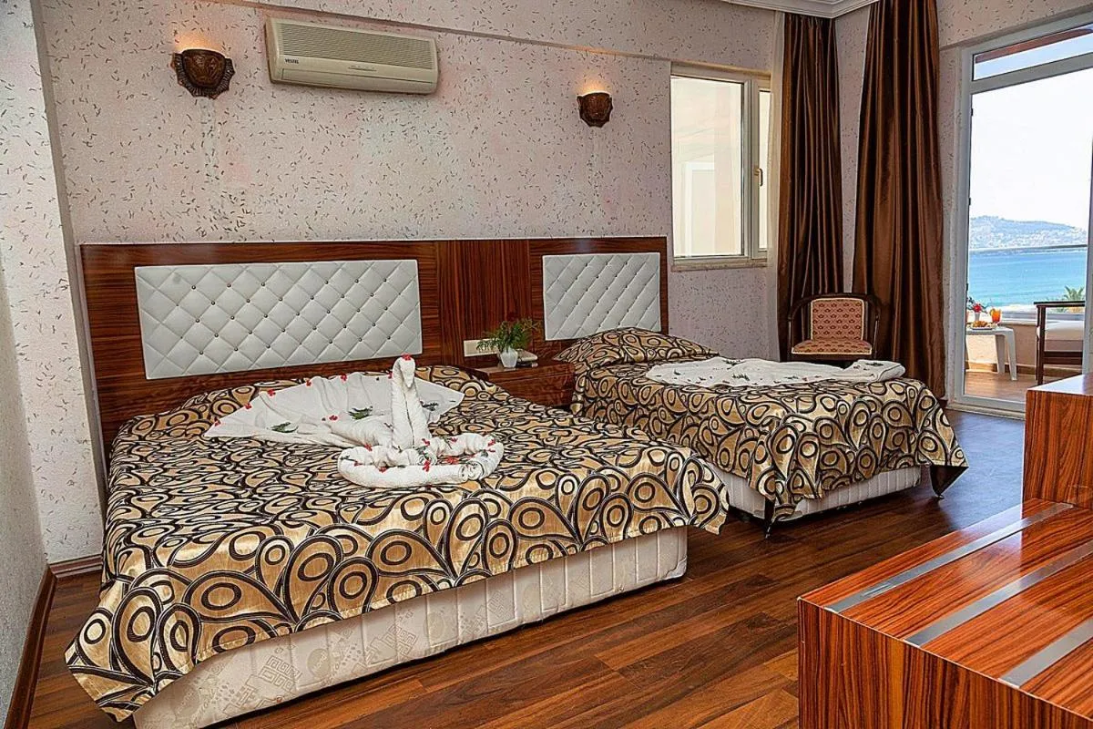 Bed in Club Bayar Beach Hotel