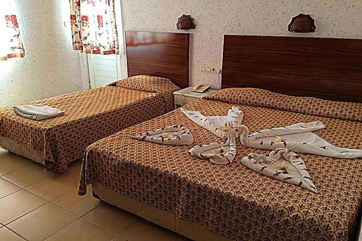 Bed in Club Bayar Beach Hotel