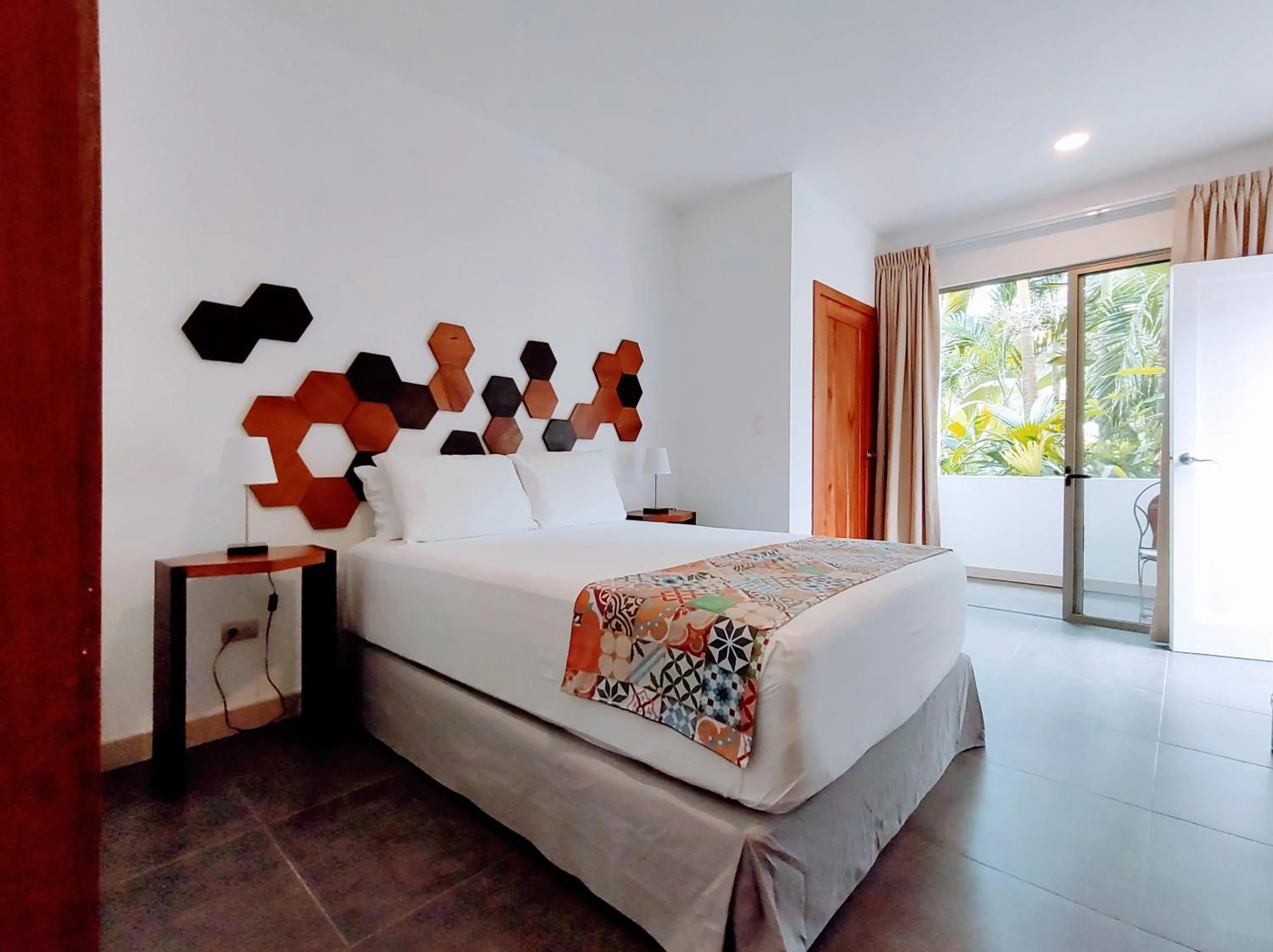 Bed in La Vela Boutique Hotel