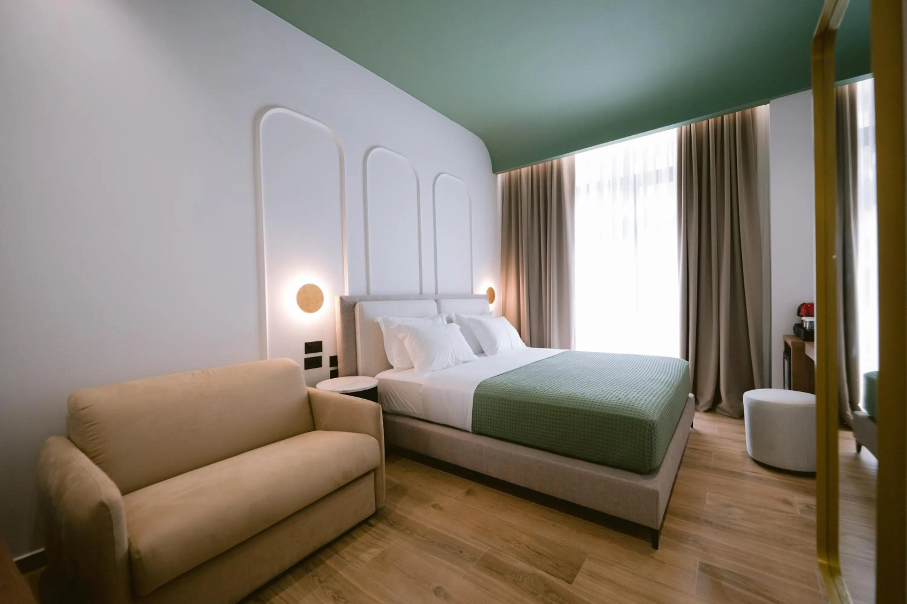 Living room, Bed in Noemie Hotel