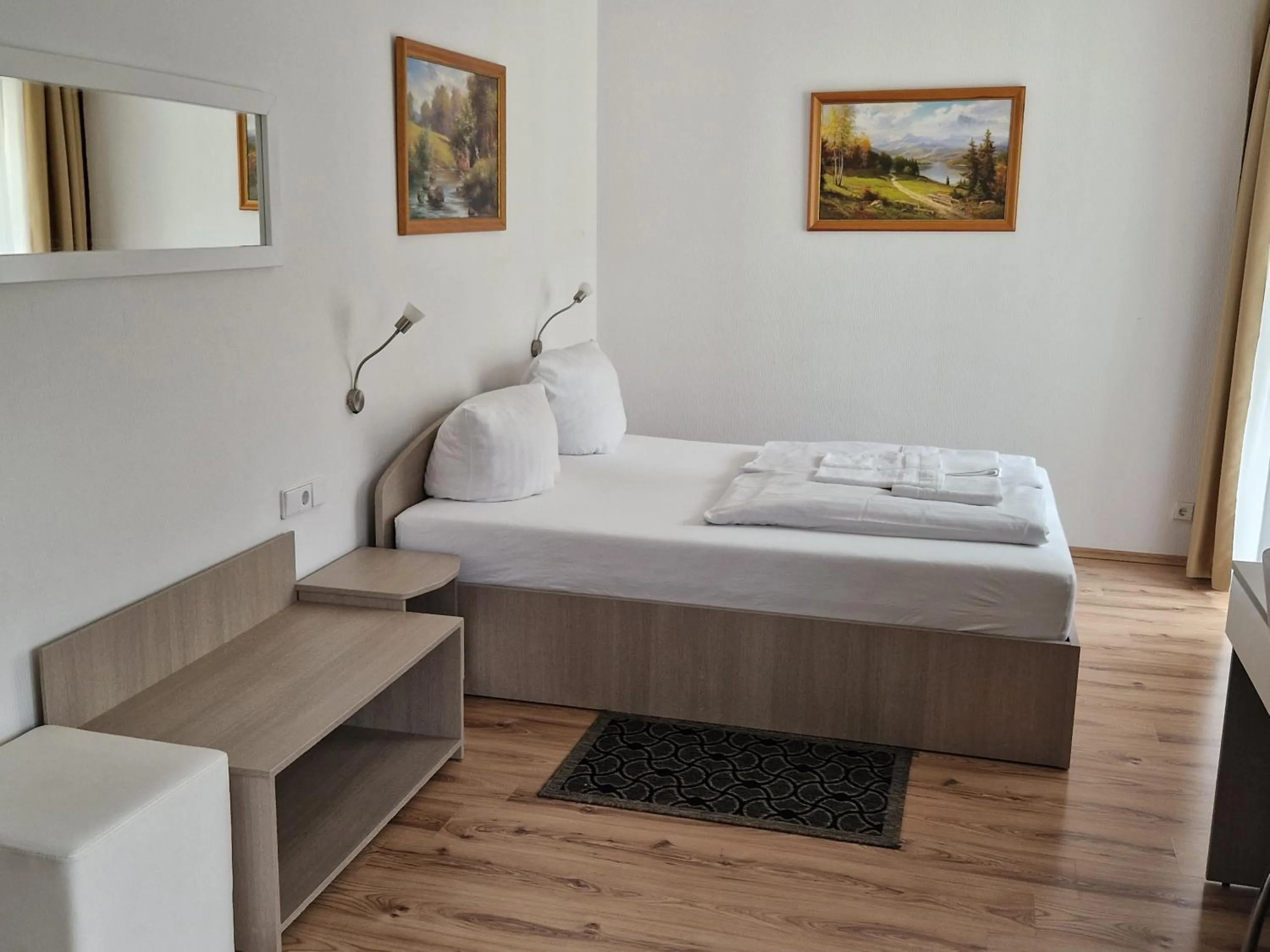 Photo of the whole room, Bed in Schwanen-Resort