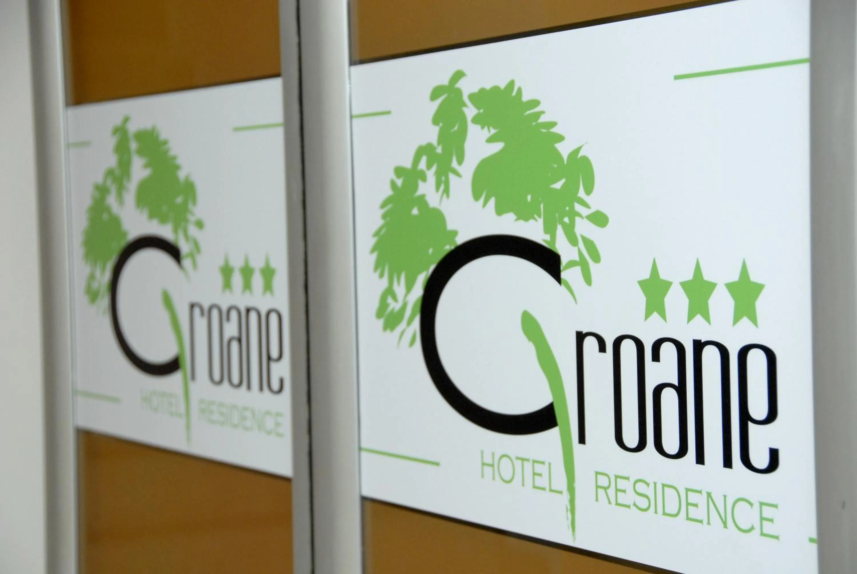 Property logo or sign in Groane Hotel Residence