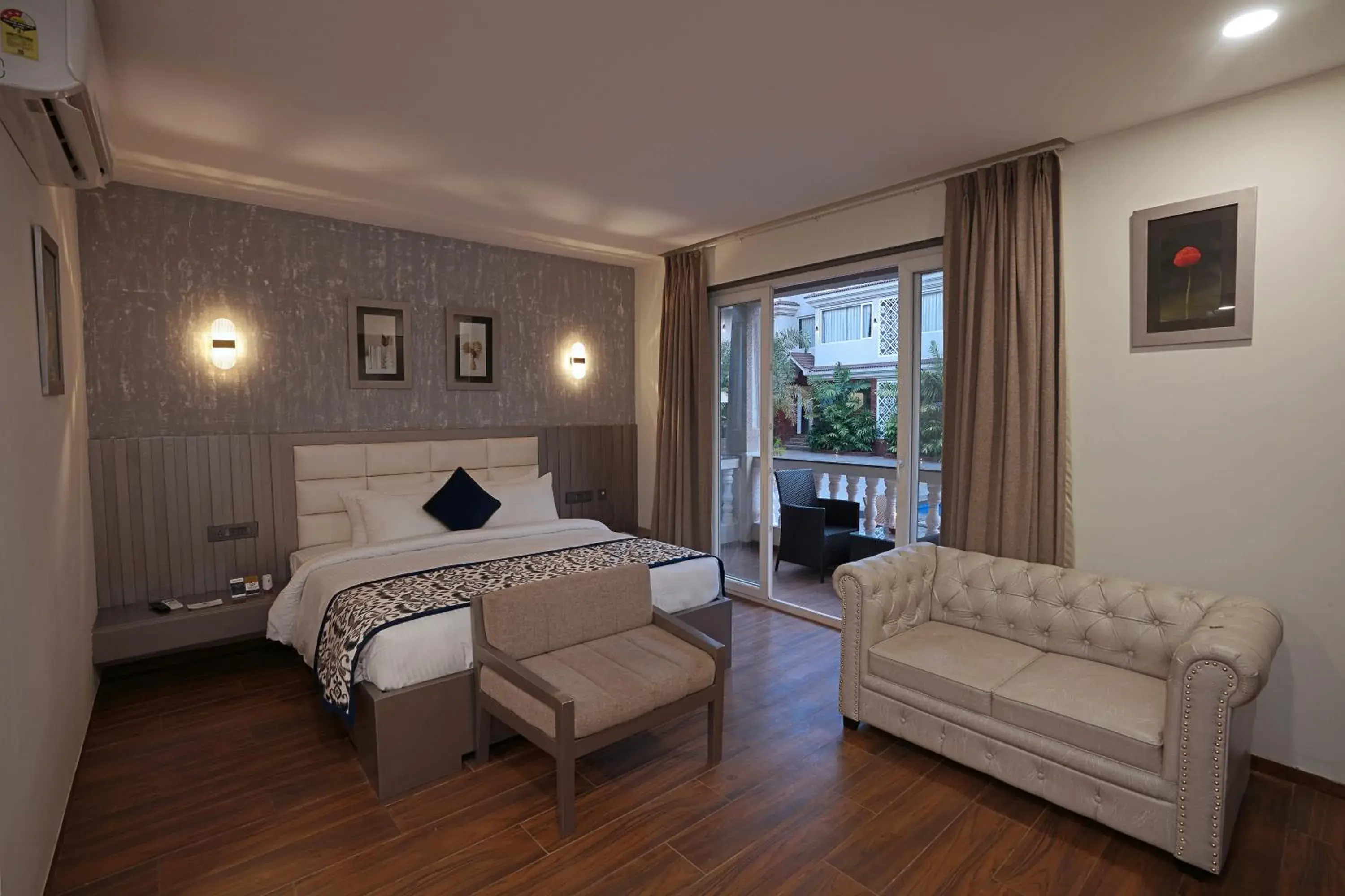 Two-Bedroom Suite with Two Double Beds and Private Balcony - Full Day Happy Hours - Pool View in Grand Continent Anjuna A Sarovar Portico Affiliate Hotel Two-Bedroom Suite with Two Double Beds and Private Balcony - Full Day Happy Hours - Pool View in Grand Continent Anjuna A Sarovar Portico Affiliate Hotel