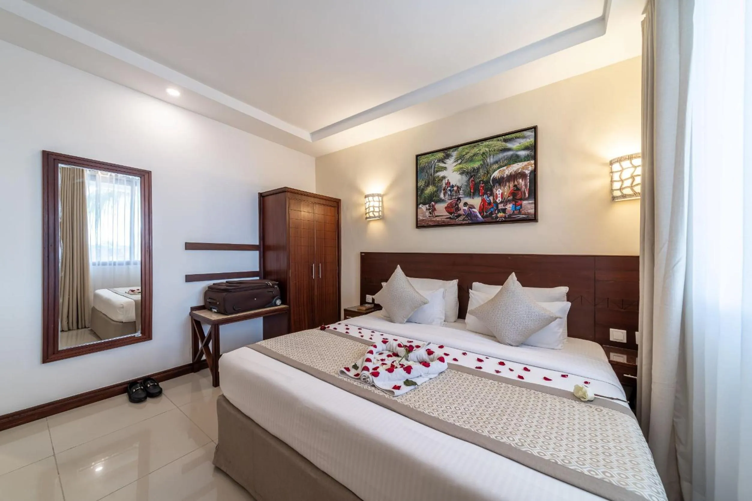 Bed in PrideInn Hotel Diani