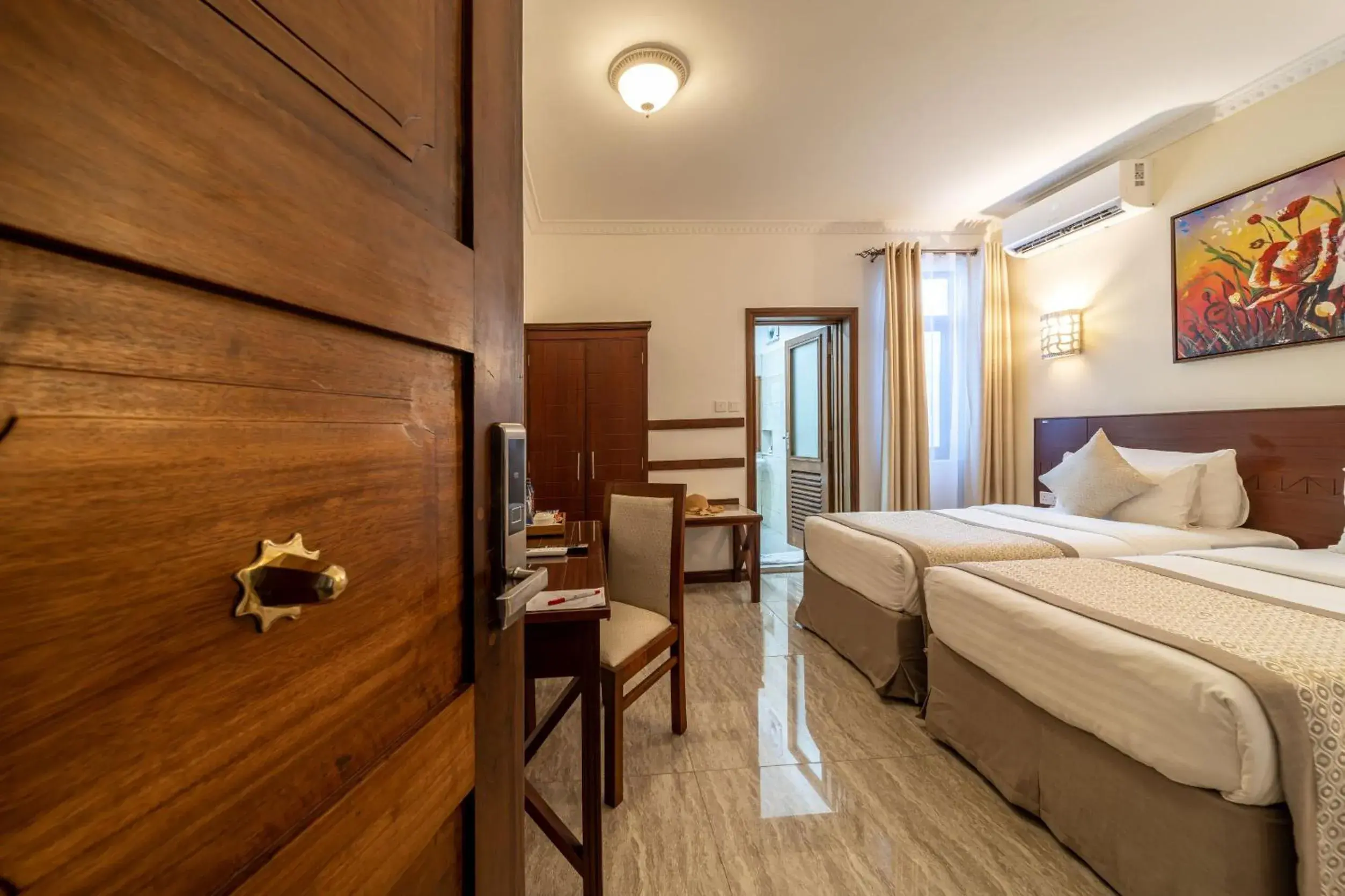 Bed in PrideInn Hotel Diani Bed in PrideInn Hotel Diani