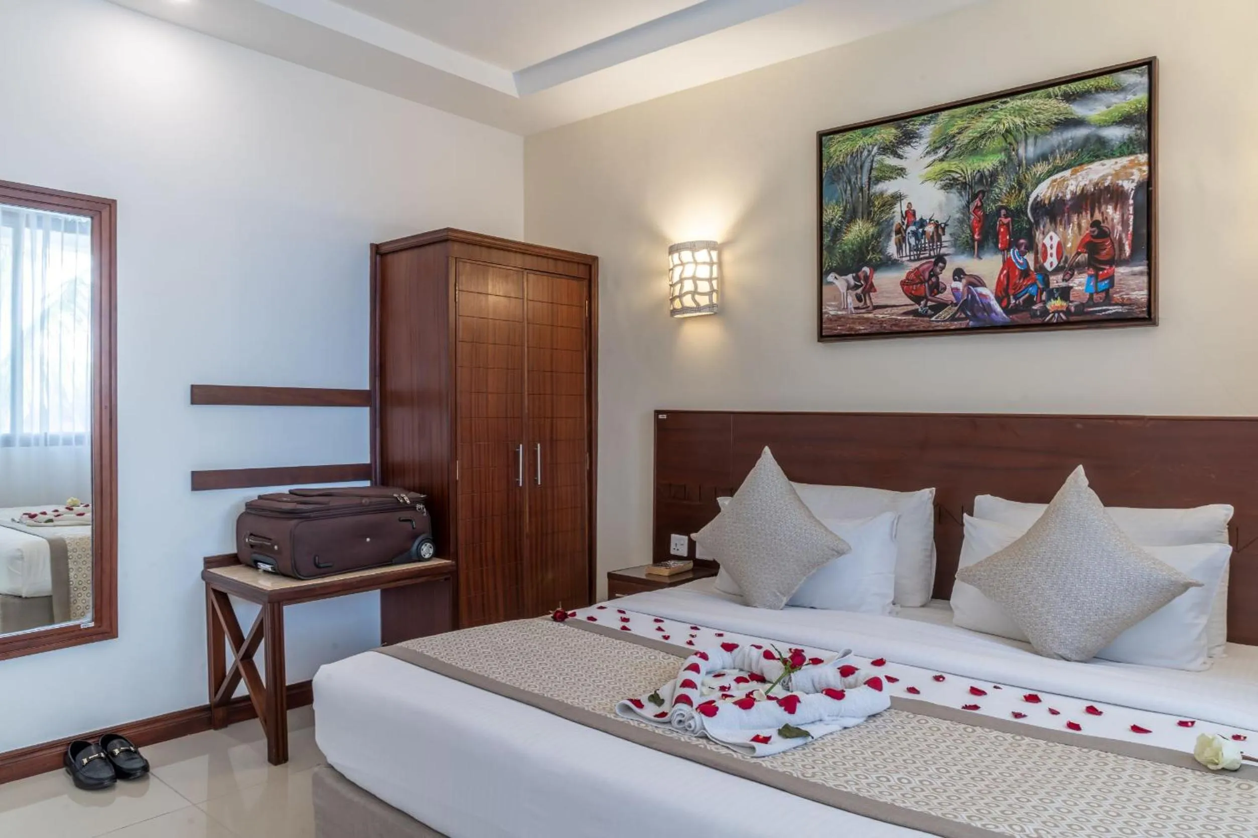 Bed in PrideInn Hotel Diani
