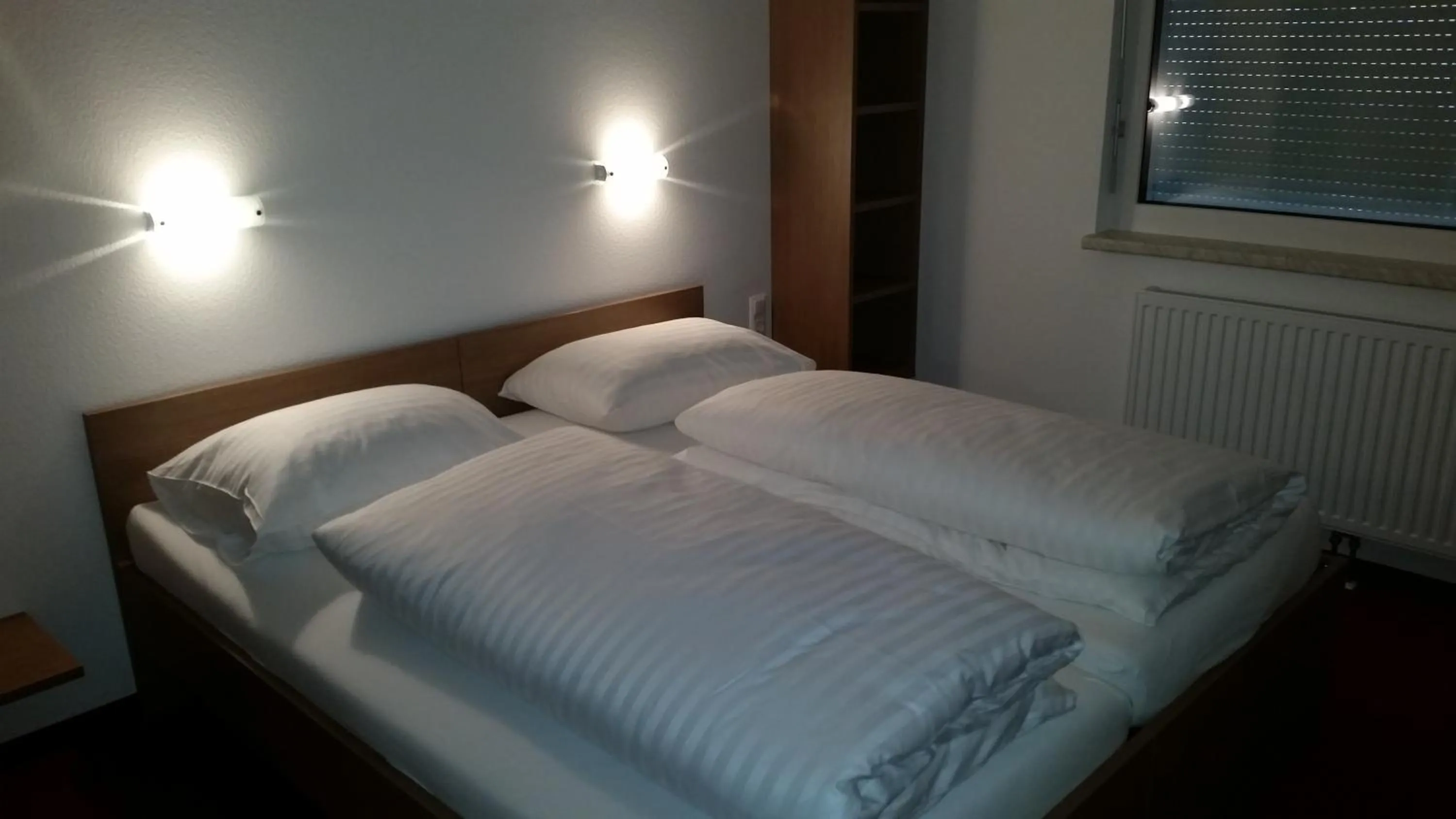 Bed in FairSleep Motel Hainburg