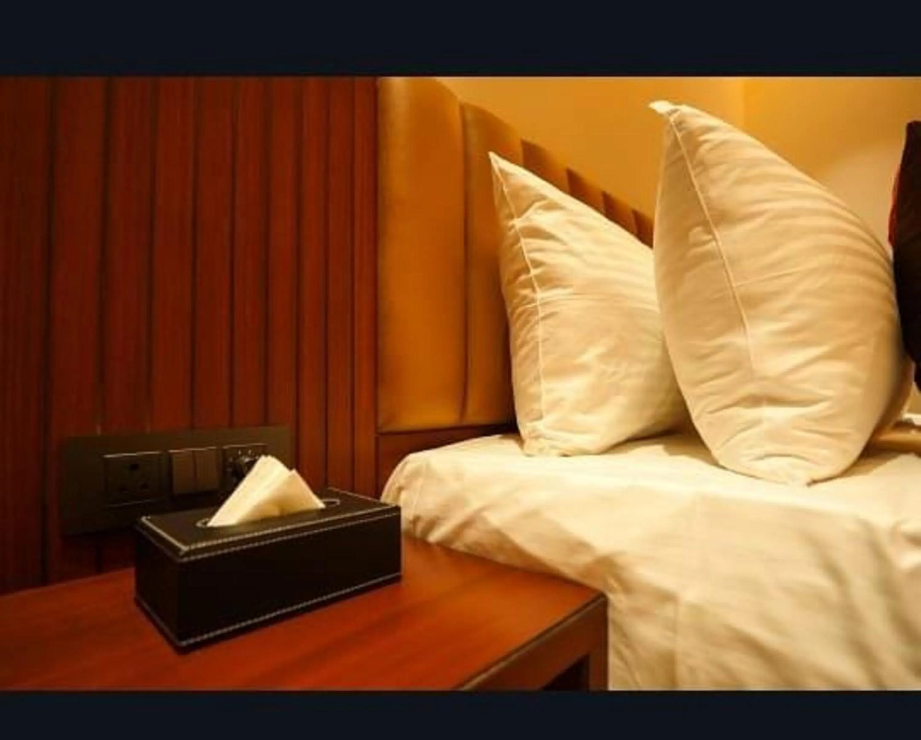 Bed in Hotel Harigovindas Express Mysore