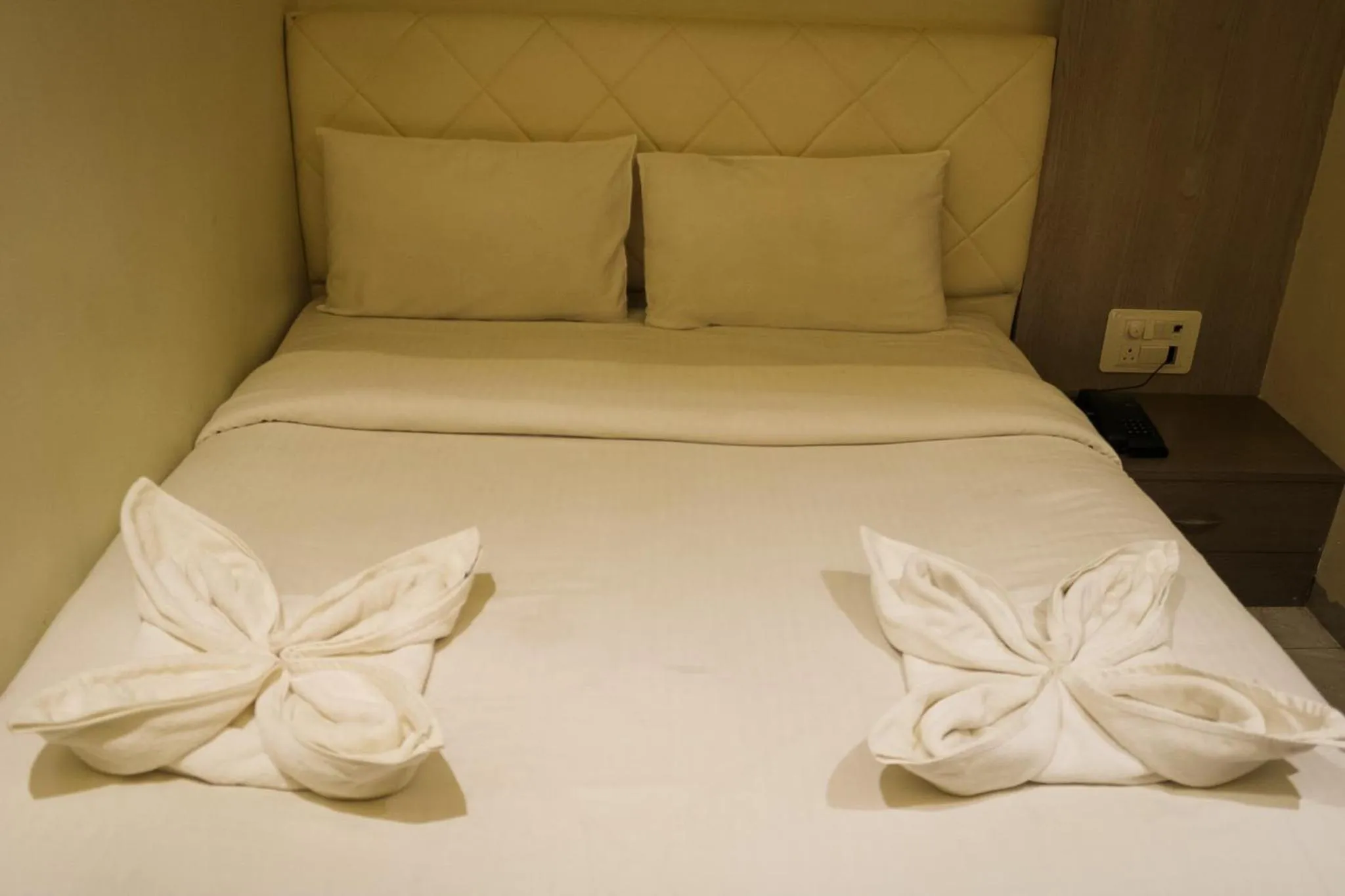 Bed in The Grand Leela Resort