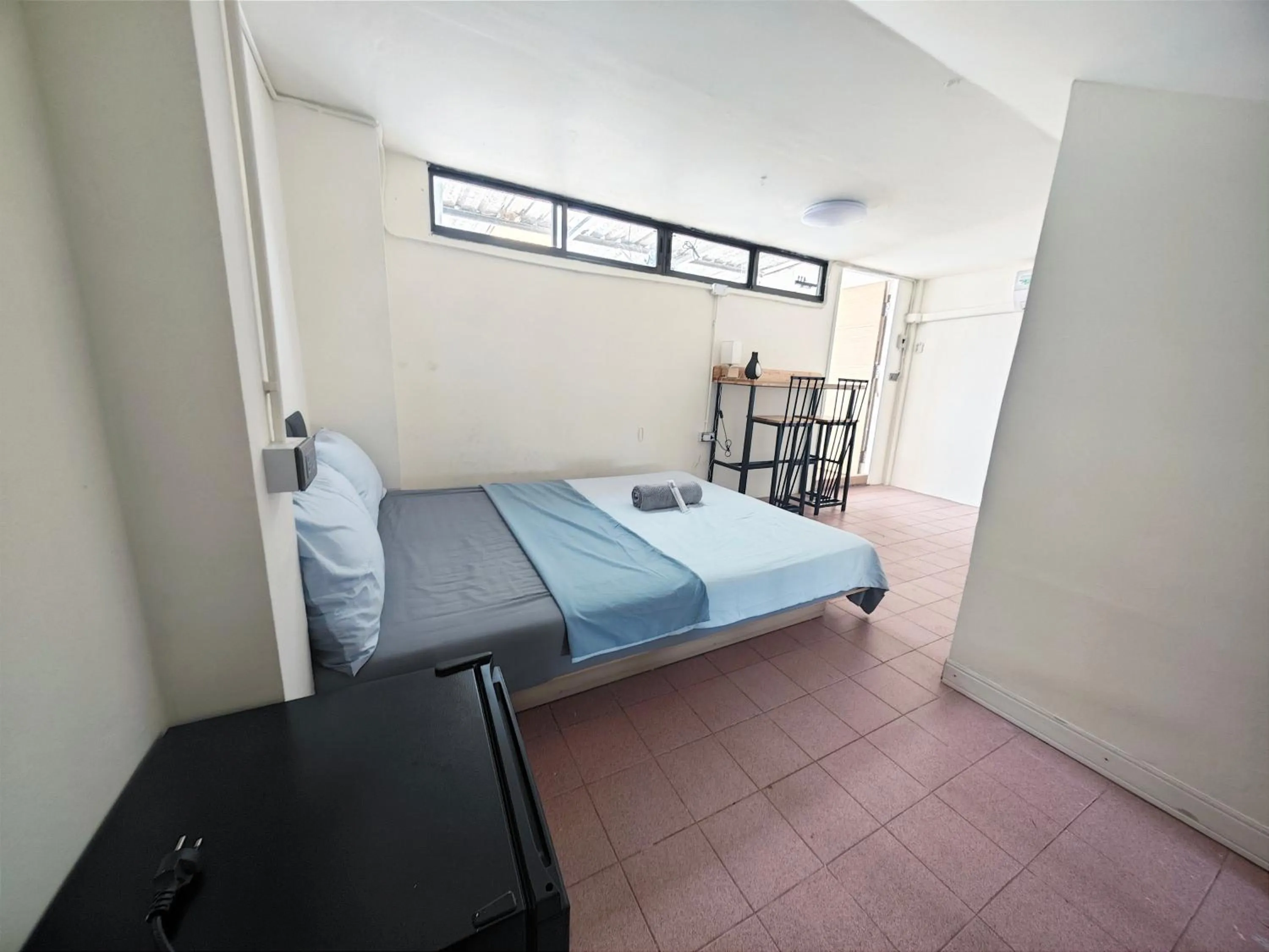 Bed in Panda Lodge Home Stay