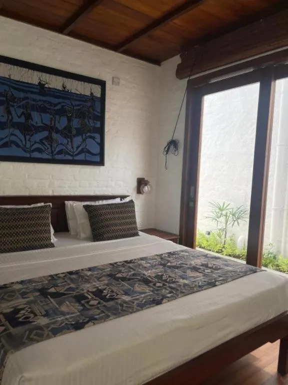 Bed in Hibiscus Beach Hotel & Villas