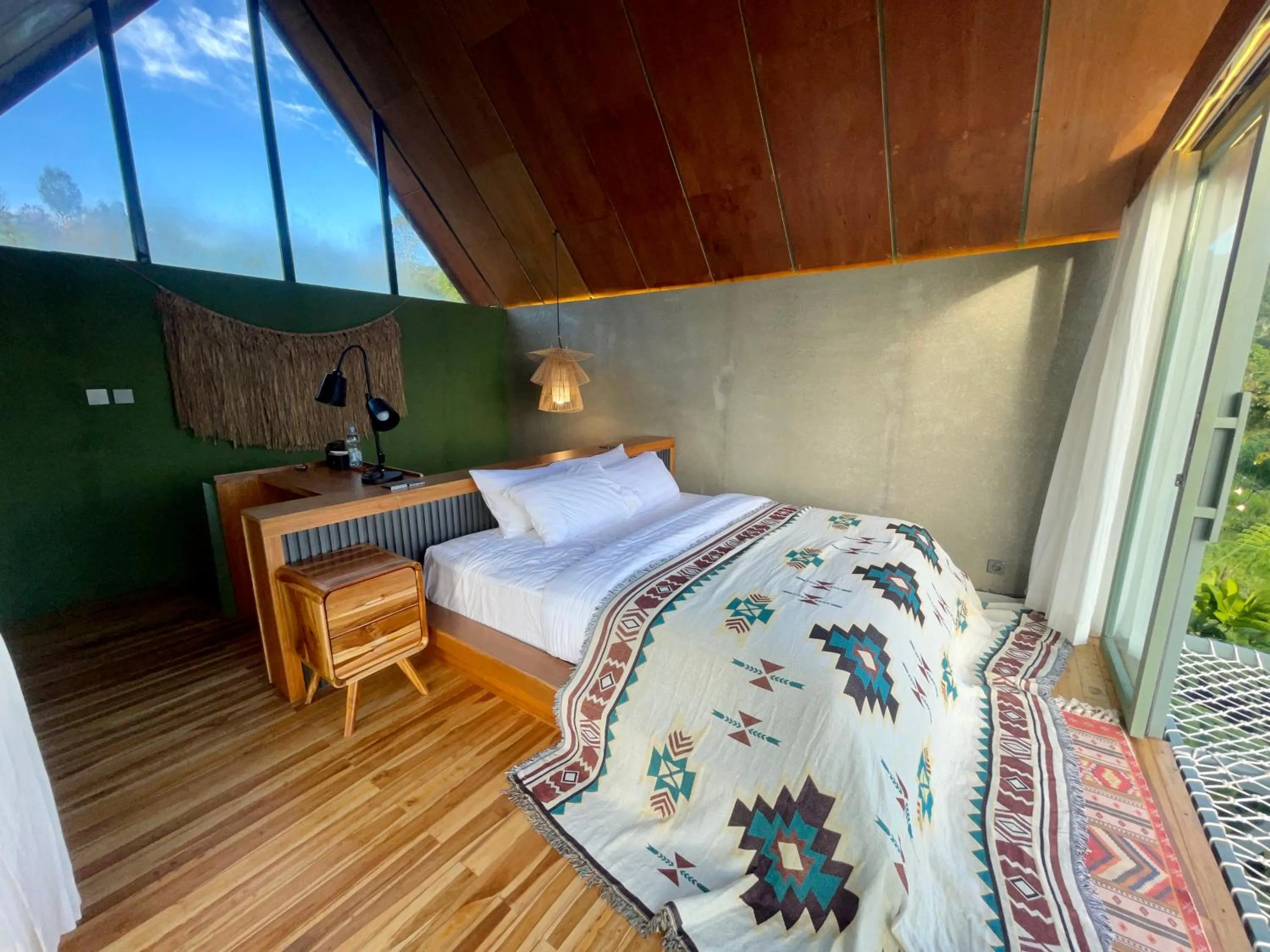 Bed in Black Wood Cabin