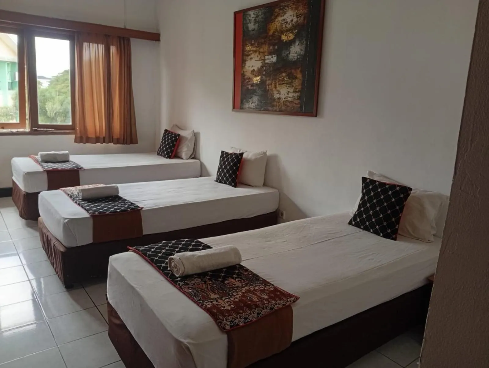 Bed in Hotel Bumi Kitri