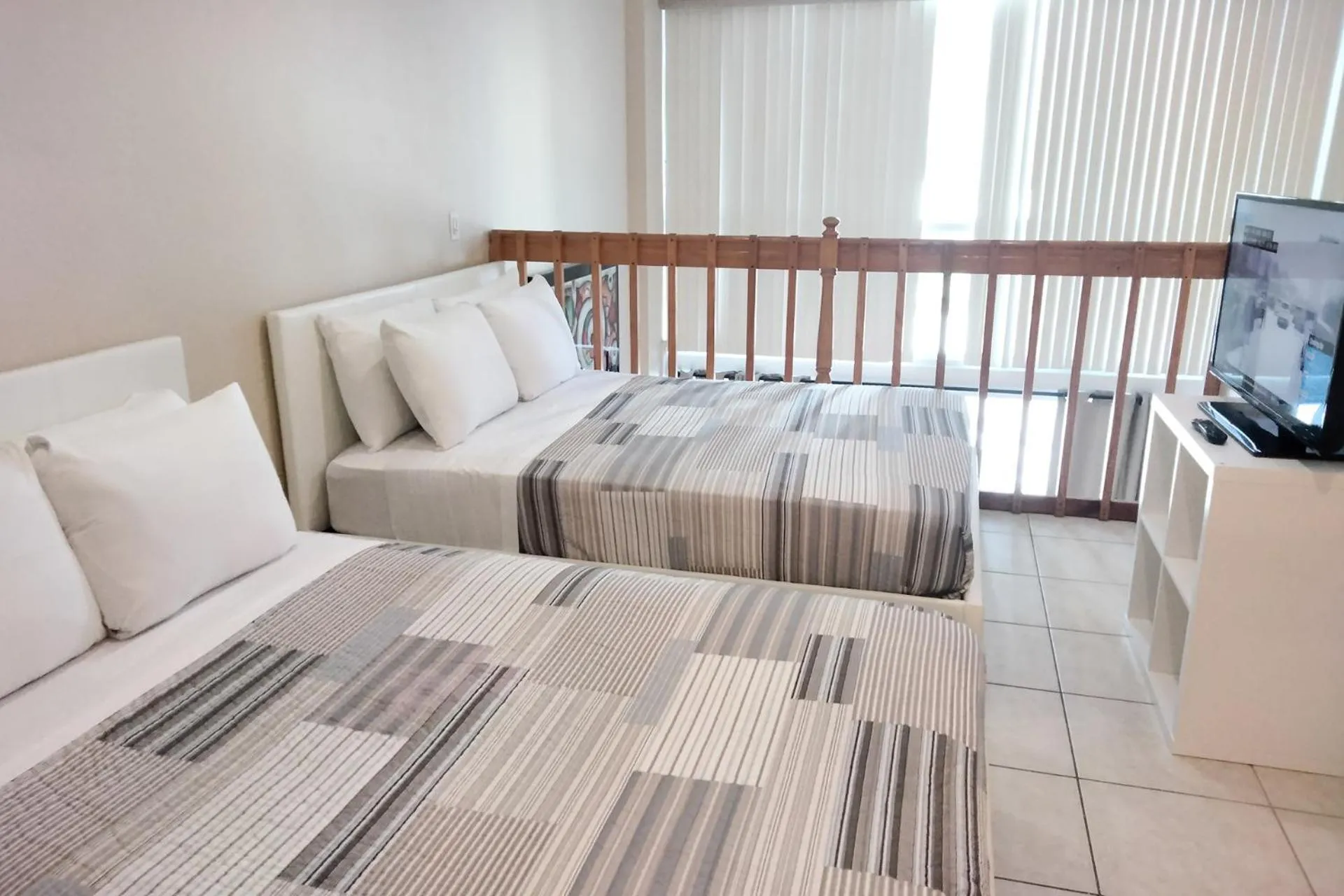 Bed in Miami Beach Apartments by MiaRentals