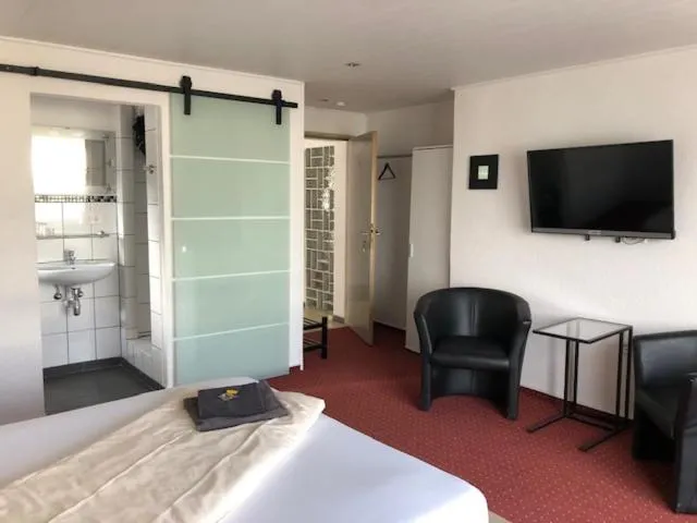 Photo of the whole room, Bed in Hotel Saarland Lebach