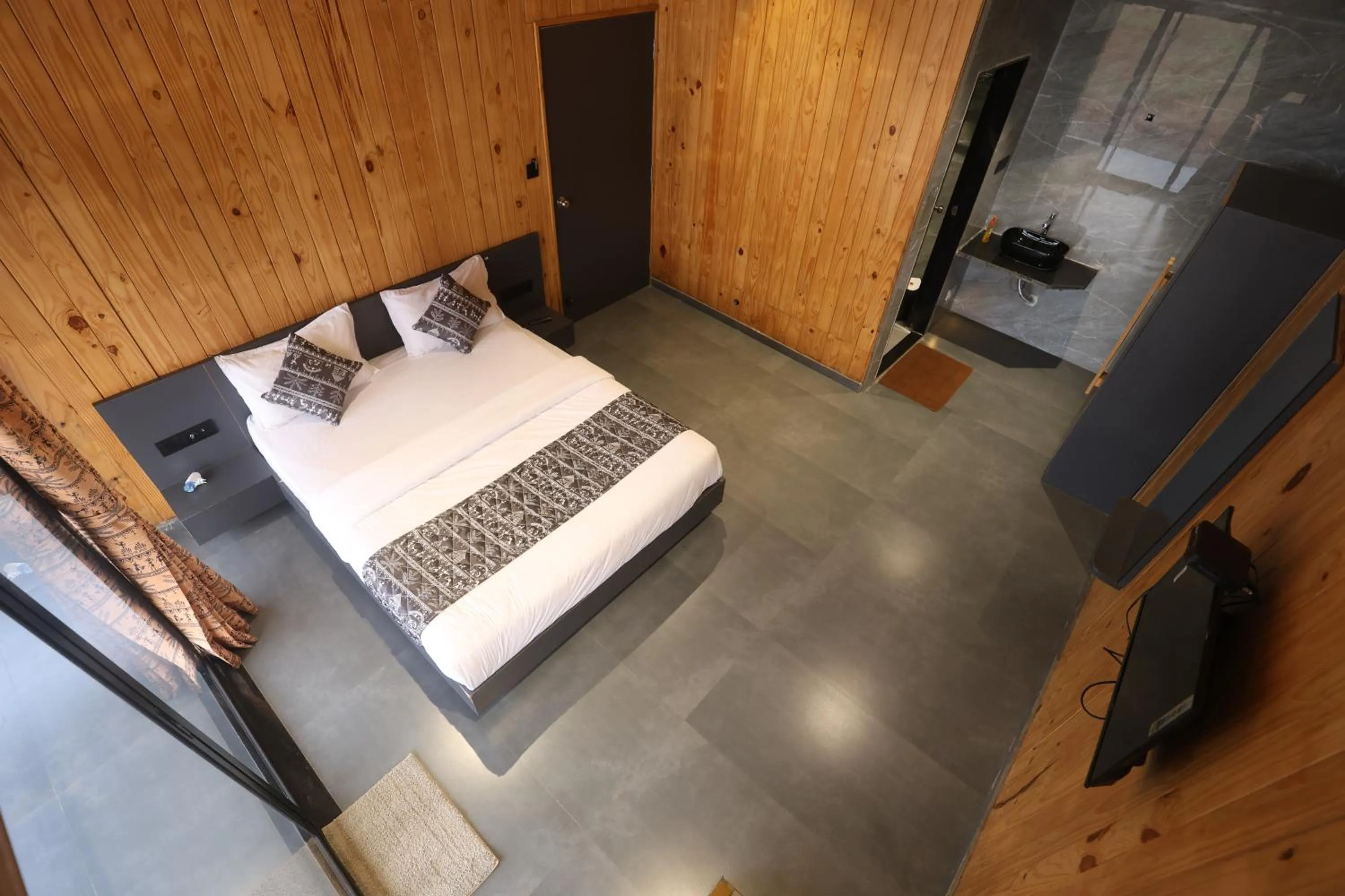 Living room, Bed in Shreephal luxurious Resort- Best resort in saputara