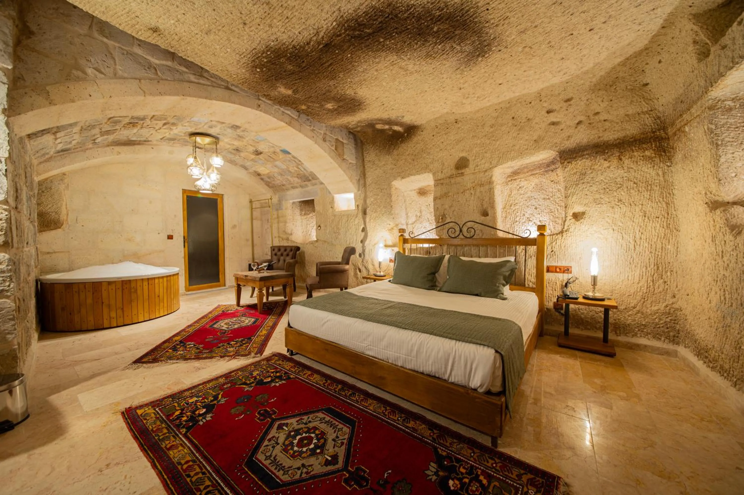 Bed in Ares Cave Suites