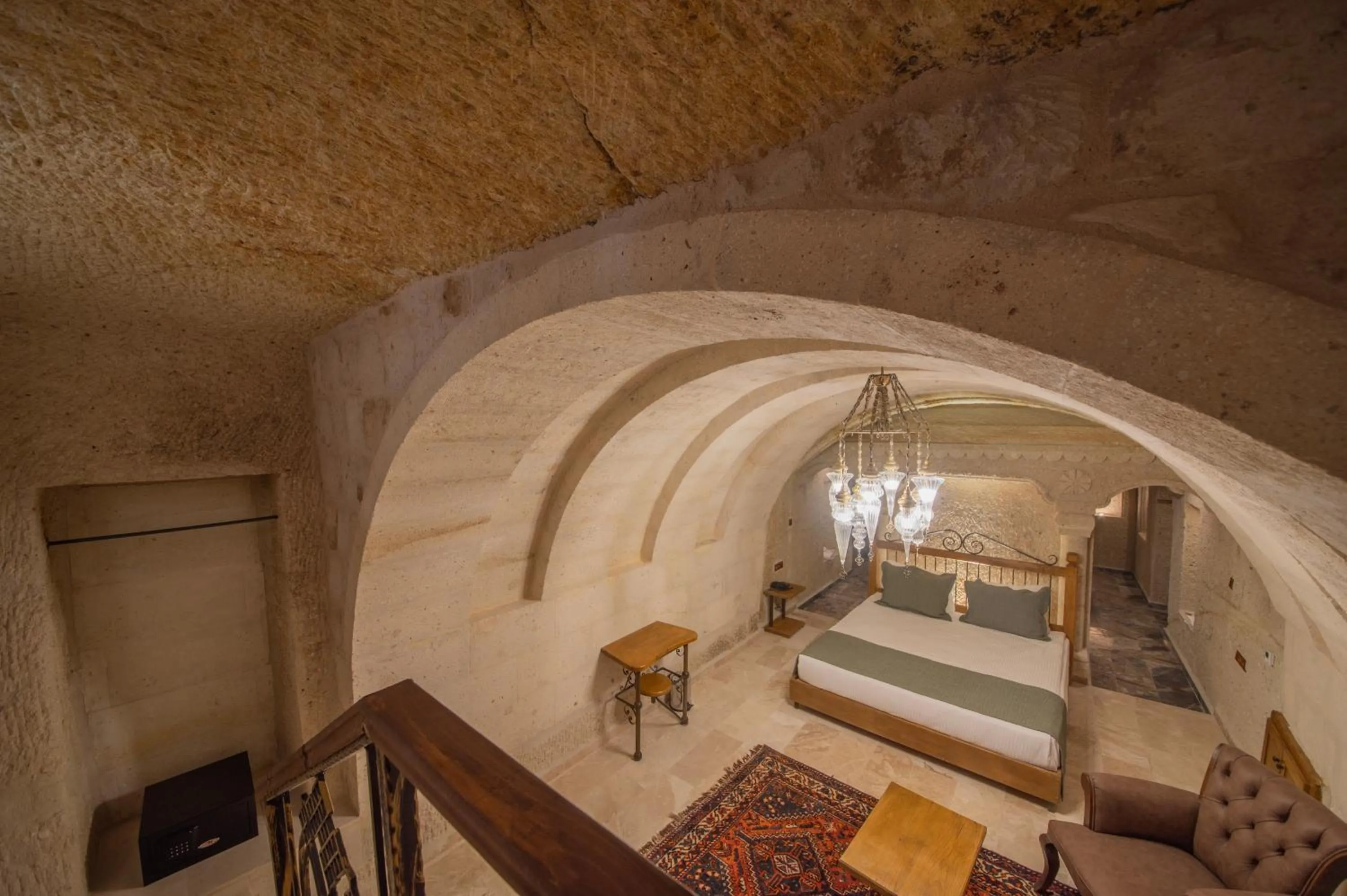 Bed in Ares Cave Suites