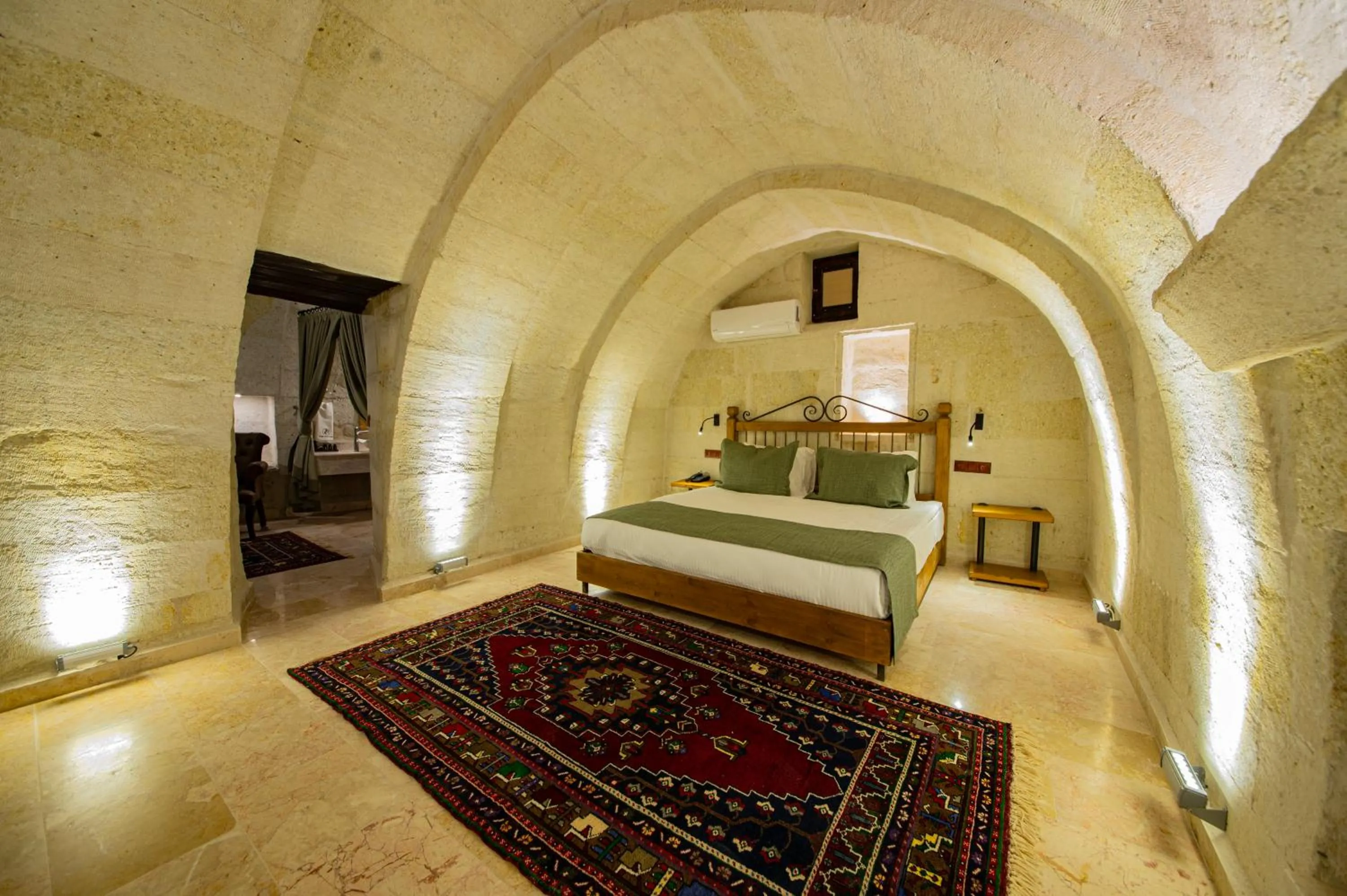 Bed in Ares Cave Suites