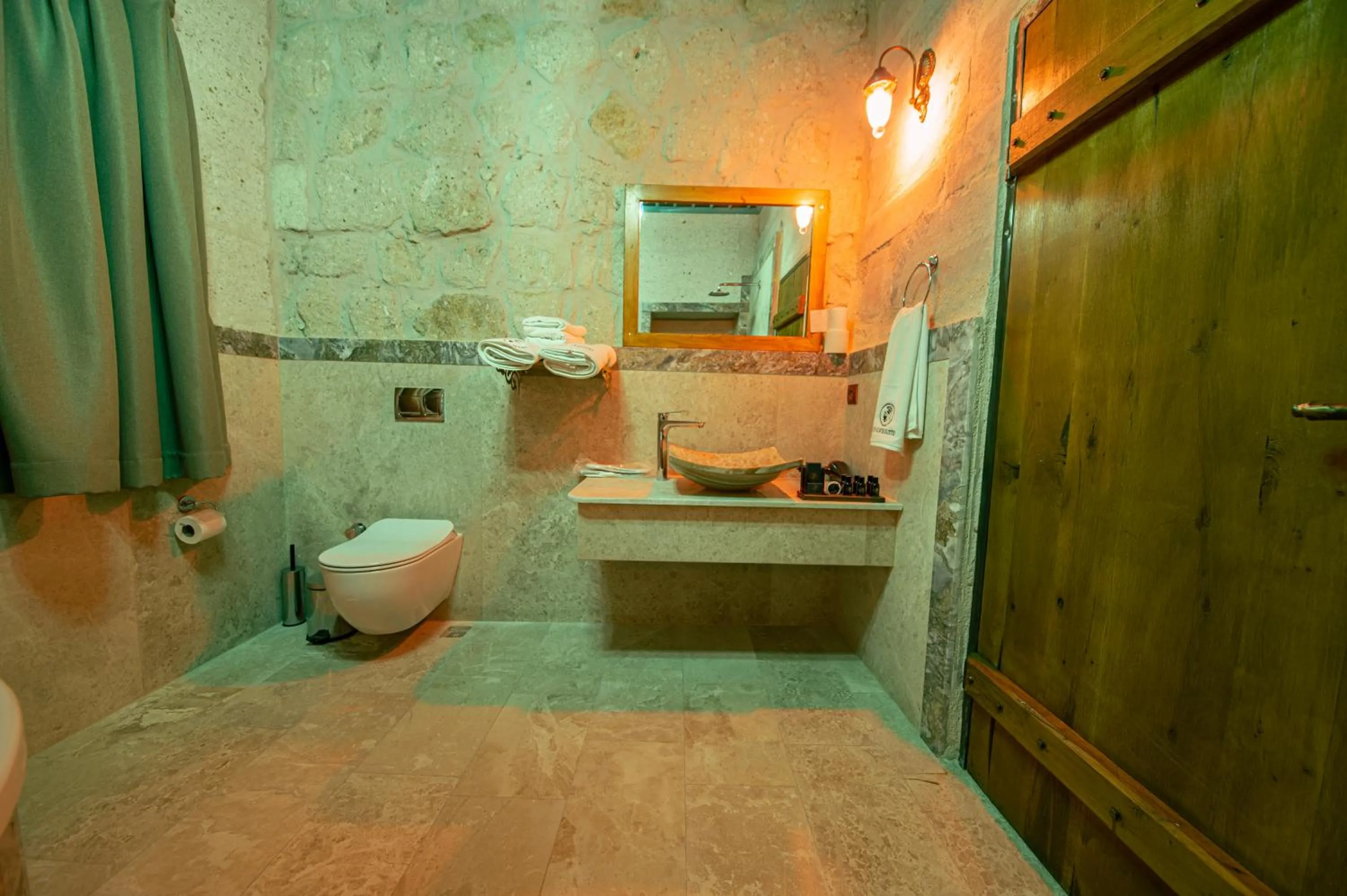 Toilet in Ares Cave Suites