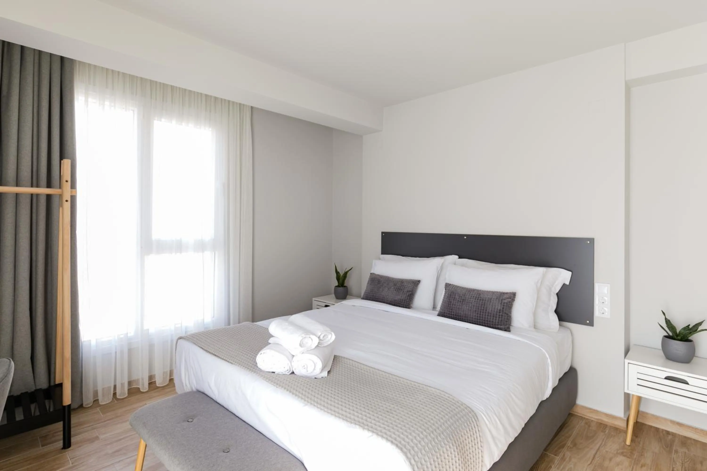 Bed in Comfort City Suites & Rooms