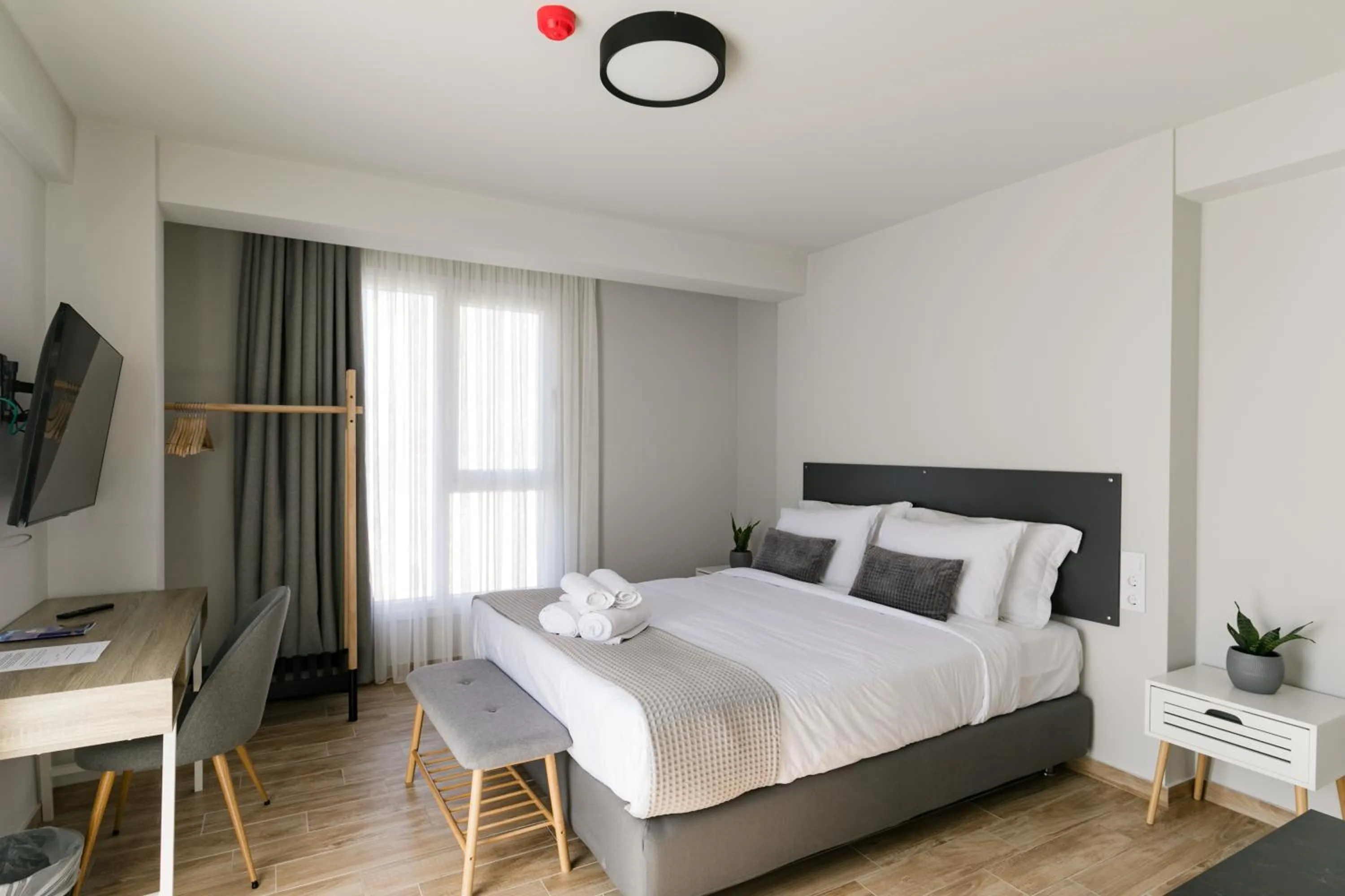 Bed in Comfort City Suites & Rooms
