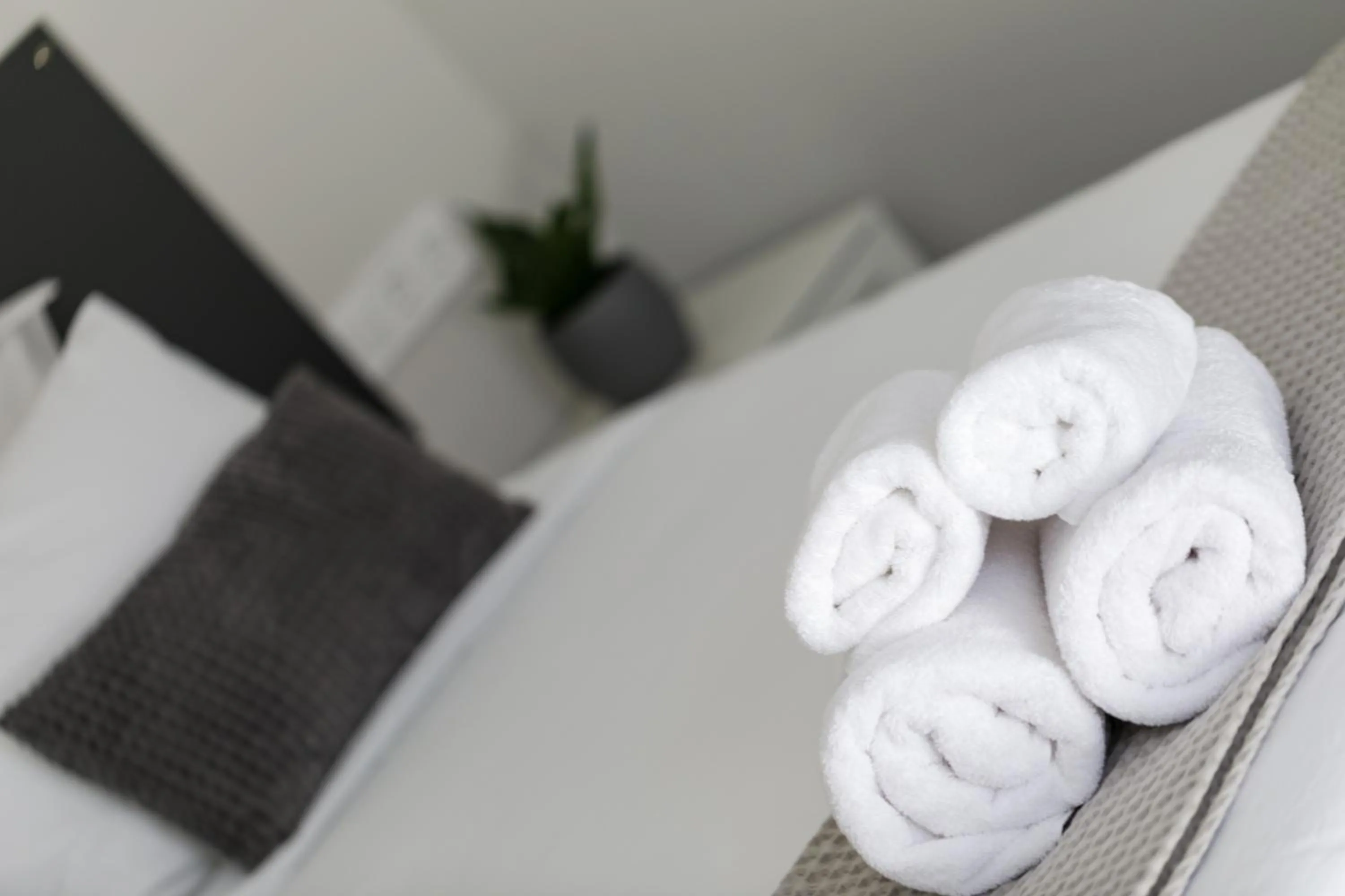 Bed in Comfort City Suites & Rooms