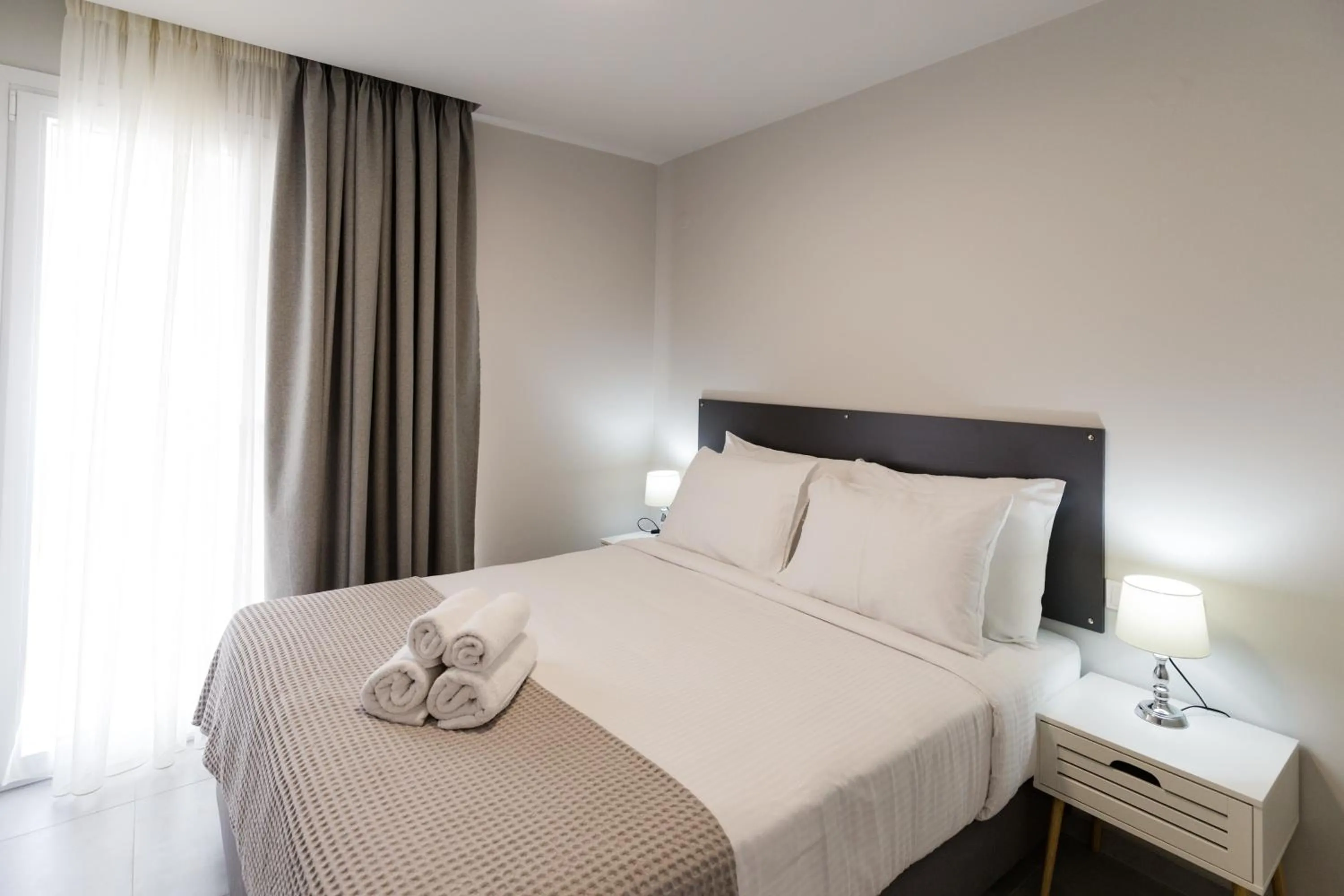 Bed in Comfort City Suites & Rooms