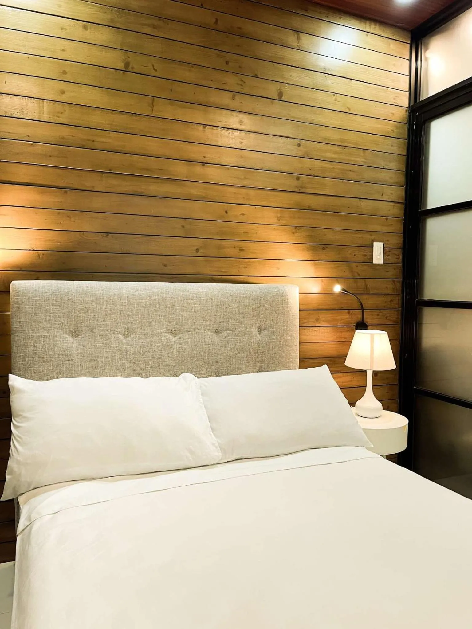 Bed in Cozy Pine Suites