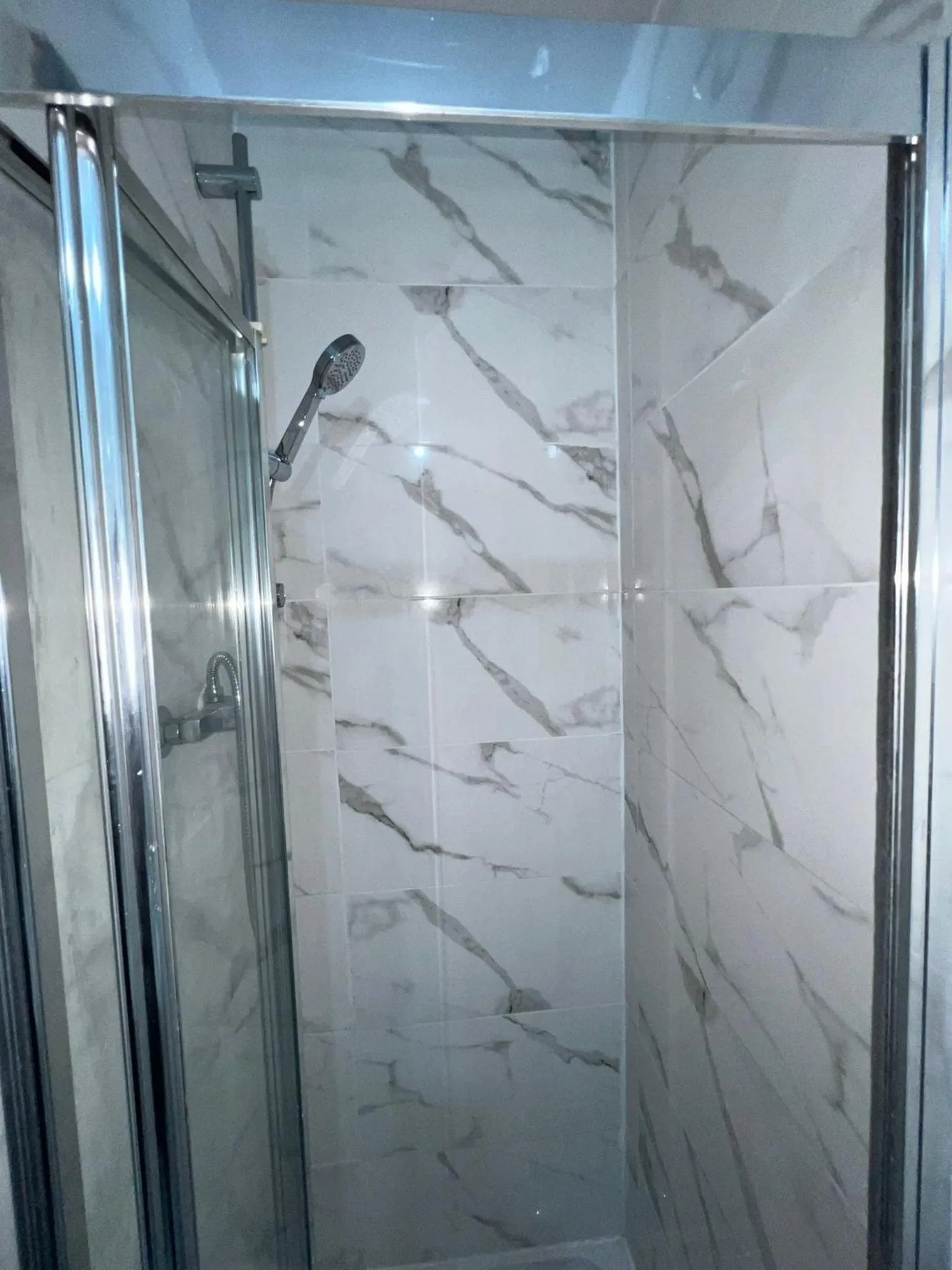 Bathroom in OYO Greenway Stays