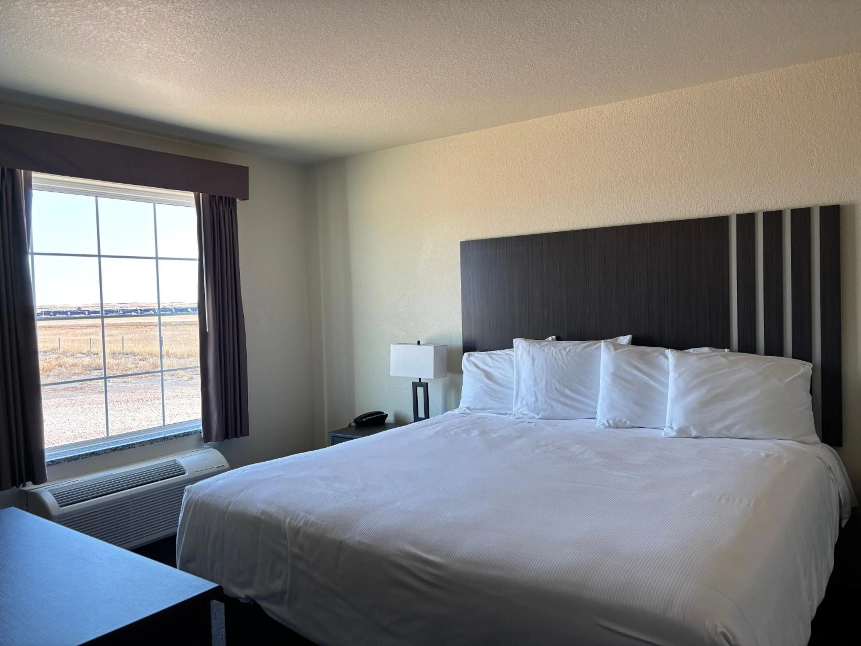 Bed in Iron Creek Inn & Suites